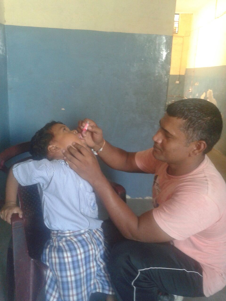 Raghav is 4 years old. He has vision difficulties, his parents tells us. "He has to hold the paper to his nose so he can read," his father tells us. Raghav requires glasses.