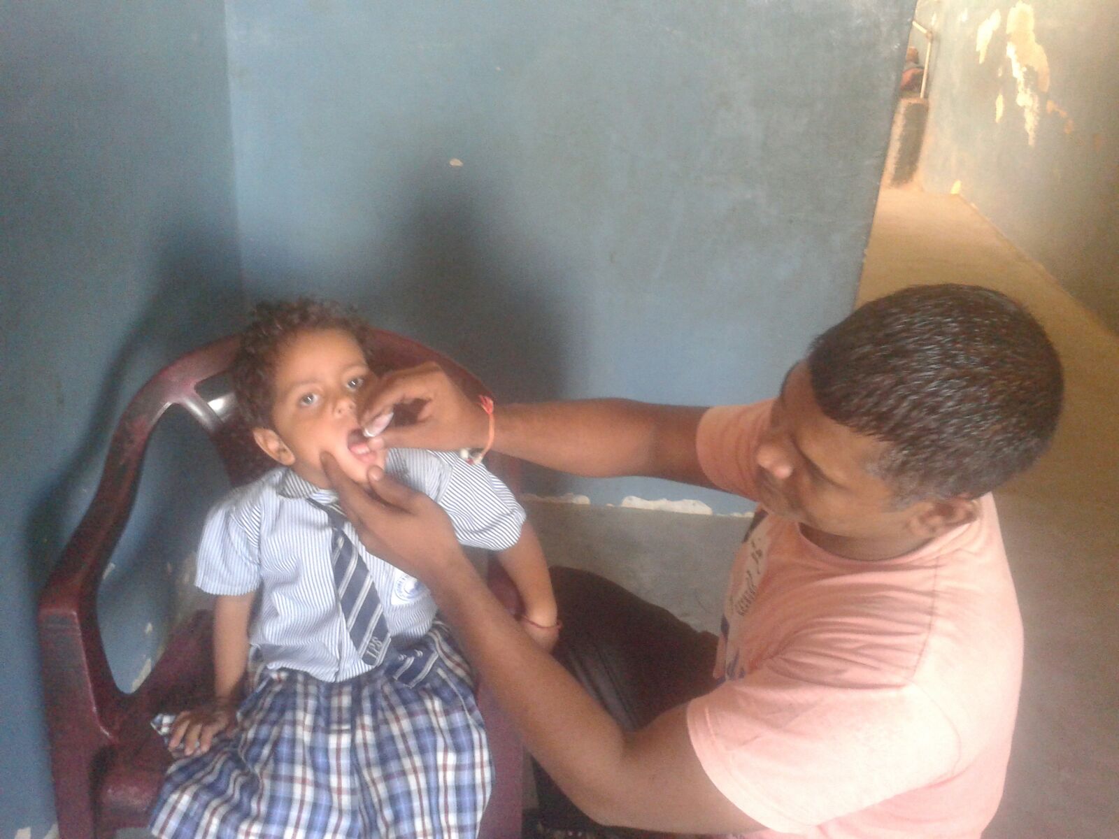 Meet Arjun, a 4 year old boy. He is receving oral vaccines in this picture. 