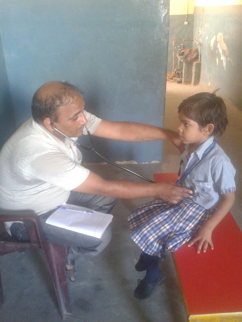 Meet Pasha. He lives with his family in the local slum. He loves playing cricket. He wants to be a musician when he grows up. He is in good health. We provided him with a general health checkup.