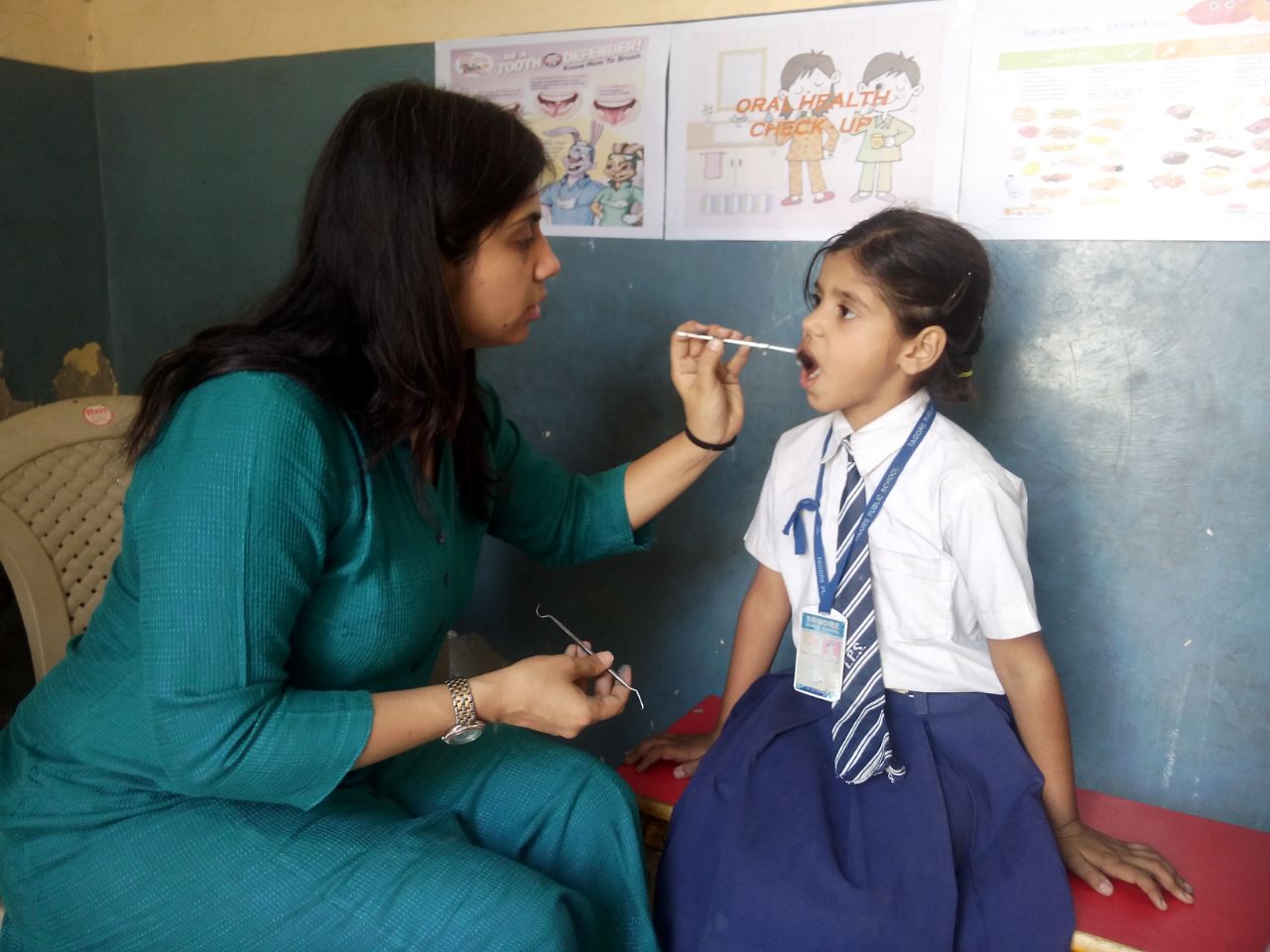This is Ajanta. She is 5 years old. This is her first visit with a dentist.