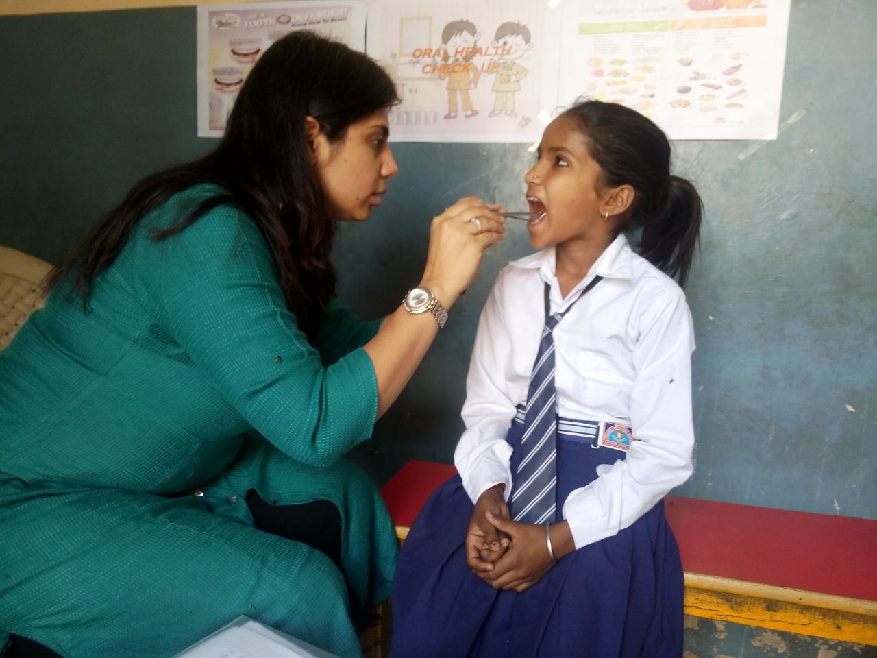 Meet Induja. She is 9 years old. She wants to be a doctor when she grows up. This was her first visit with a dentist. 