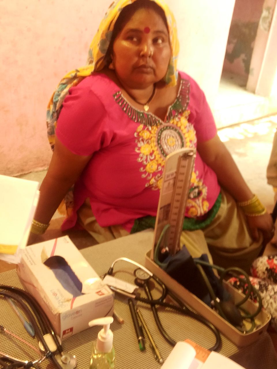 This is Amoli. She has high blood pressure. She says she has only been to a physician once in her life, when her third child was born. 