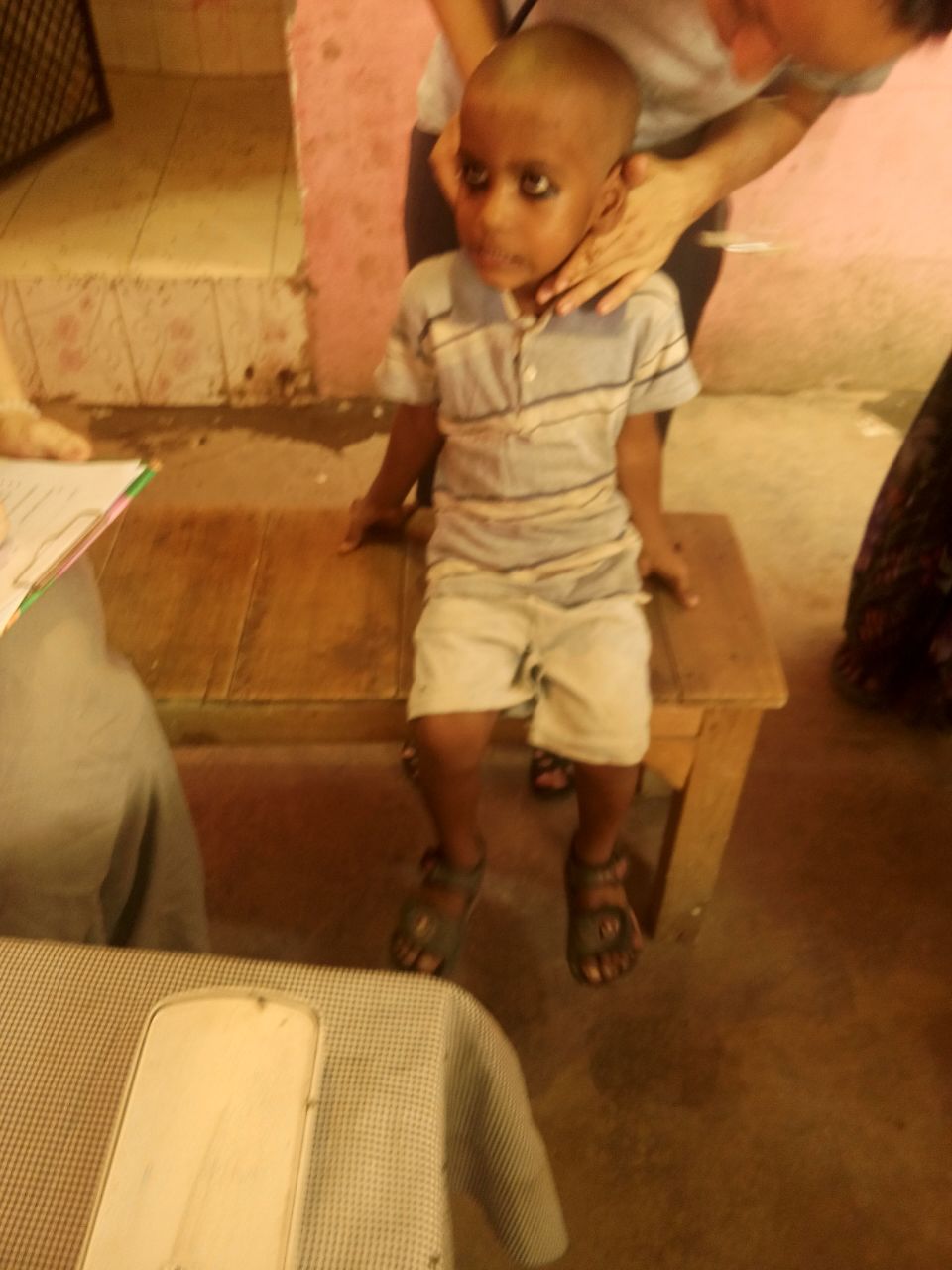 Meet Alok. He is 7 years old. Prior to this general health checkup camp, he had never visited with a physician before. His parents wanted him to receive a medical evaluation. 