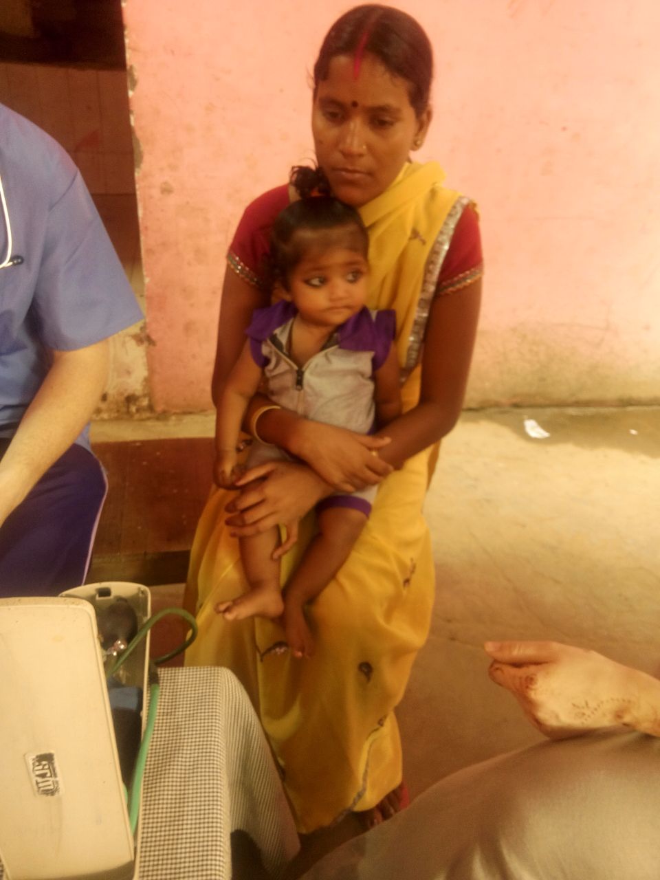 This is Malti, with her daughter Priya. Malti is concerned about Priya because she has been vomiting and having diarrhea. Priya requires further tests and medical treatment. 