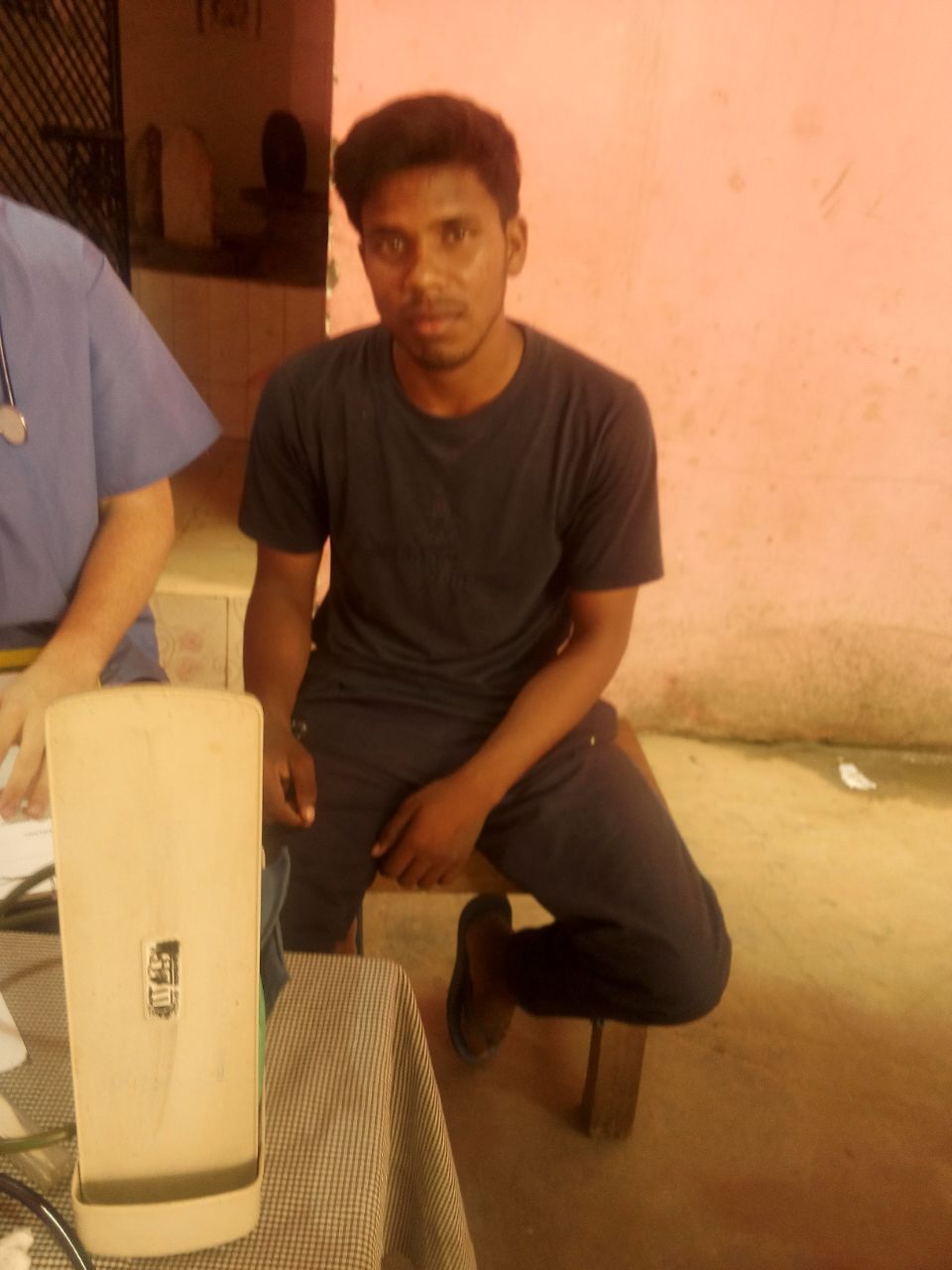 This is Nikhil. He works as a laborer. He recently fell off a ladder while working, and his right knee has been hurting him, making work difficult for him. He needs an x-ray and medical treatment. 