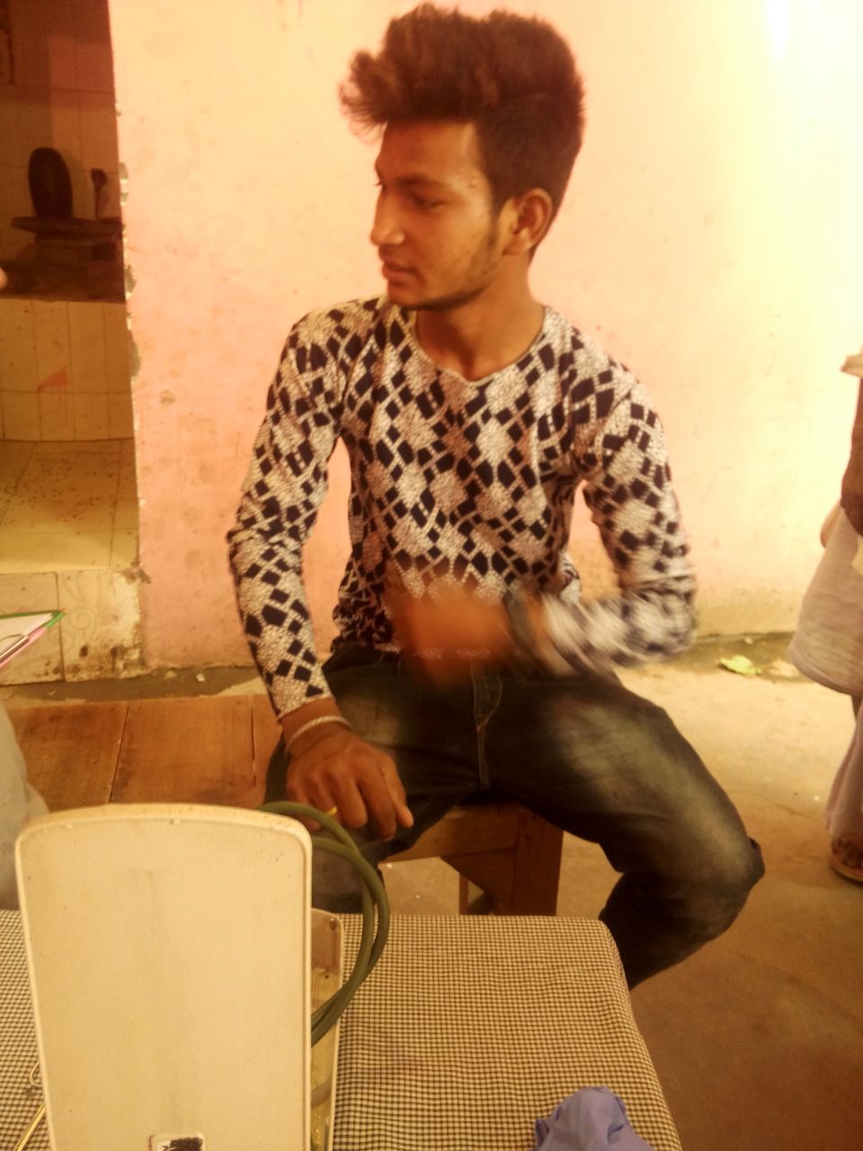 This is Prateek. He sells fruits on the side of the road. He has been having stomach pain, he tells us. He wants his younger sister to be a doctor when she grows up. 