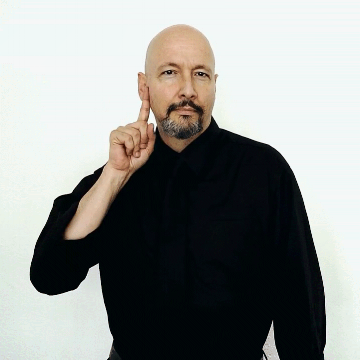 American Sign Language: “ Deaf .” Touch your finger on your cheek near your ear, then move your finger in a small arch and touch it near the mouth. Start and end the sign on the cheek.