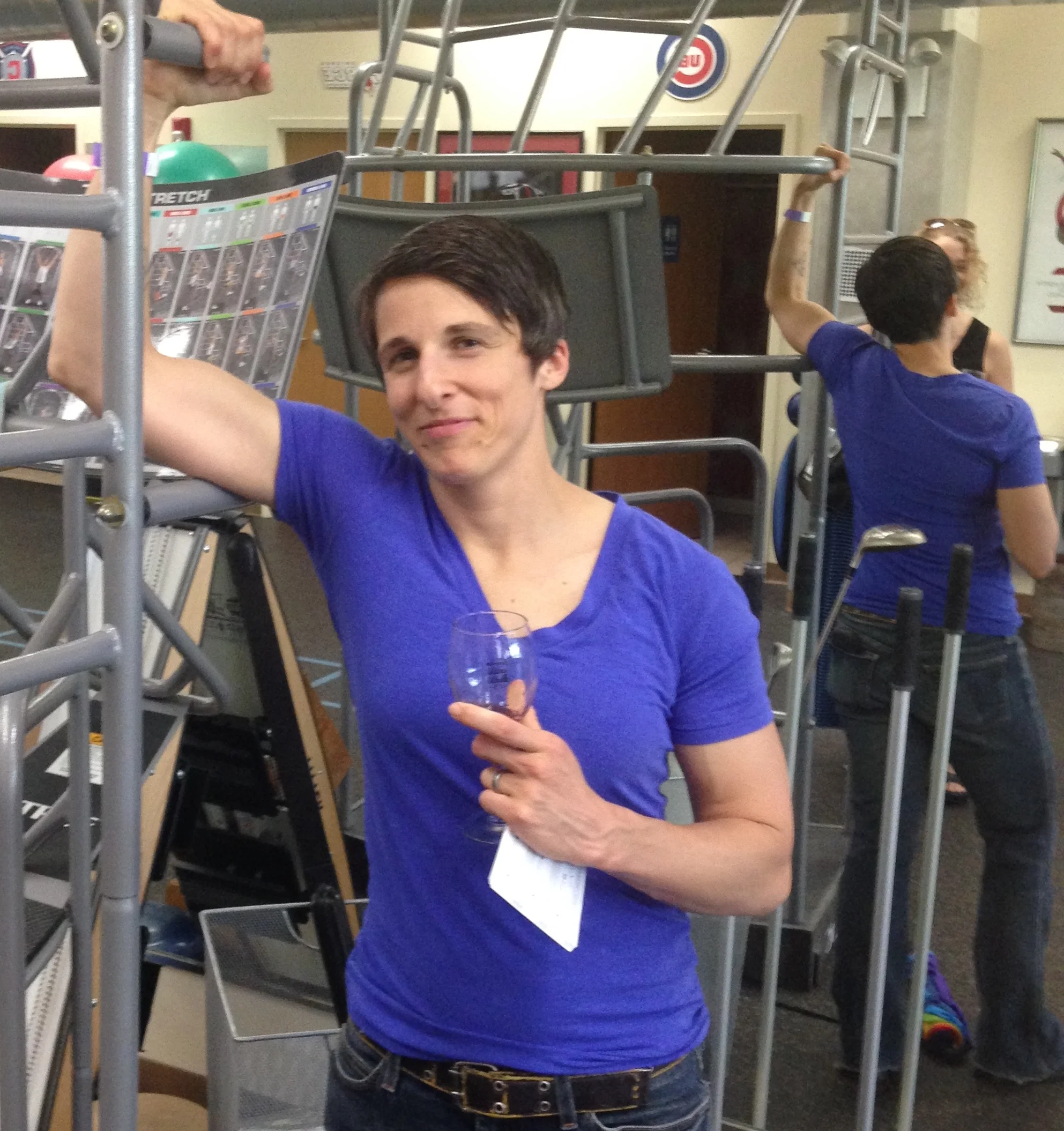 Katy, the most buff of us all, posing, at my insistence, with the equipment at Athletico.