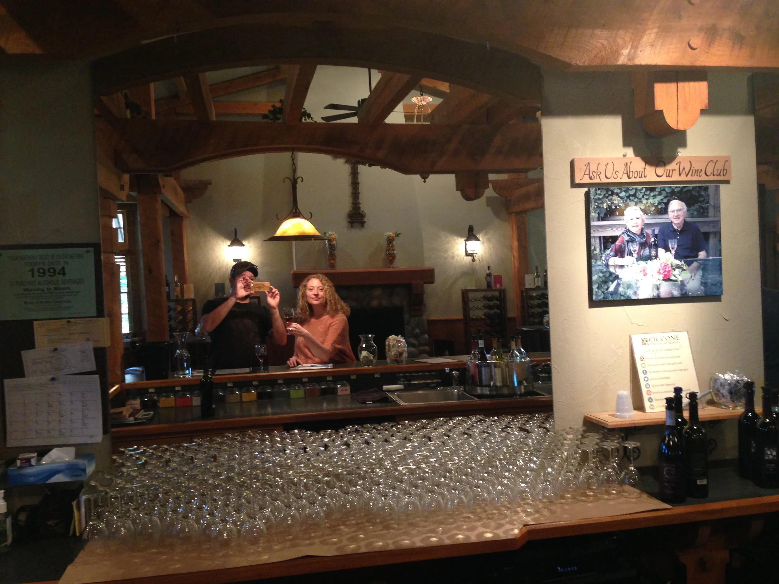 Gabe and I in the tasting room, snapping a photo of a photo of Silvio and his wife, Joan. 