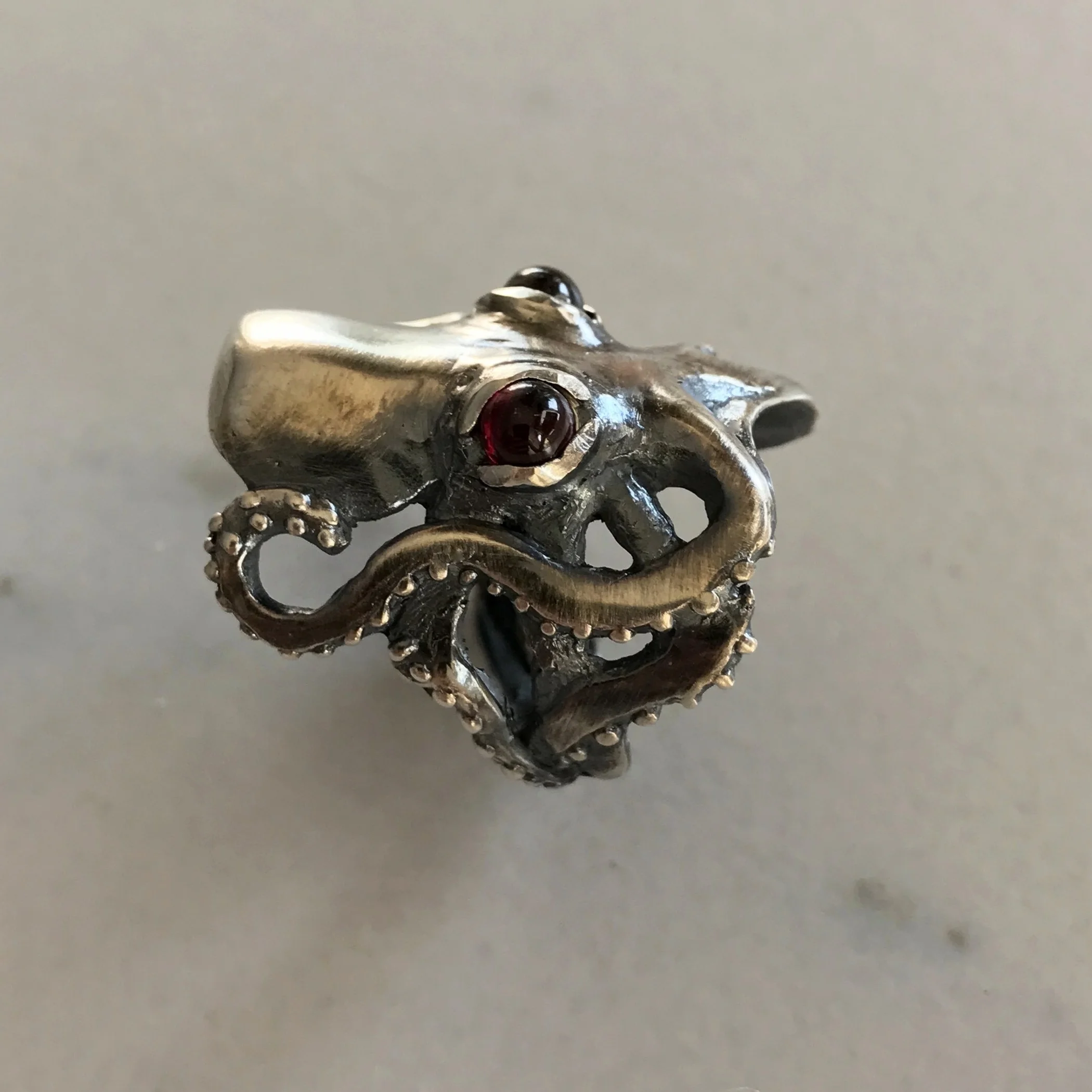 Evil Octopus Ring with Cabochon Red Garnet Eyes in Oxidized Sterling Silver by Beloved Little Lamb