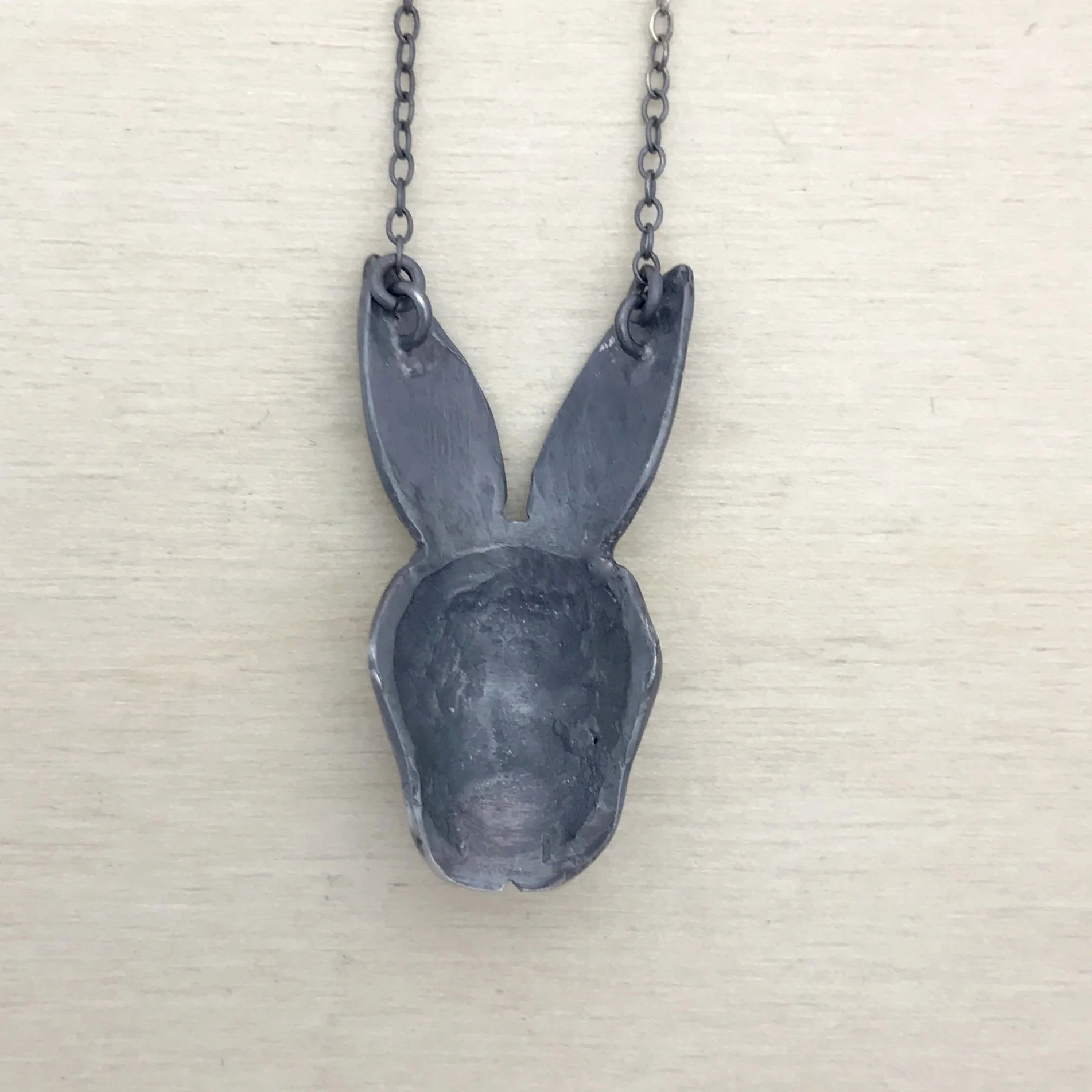 Evil Bunny Necklace with Red Garnet Cabochon Eyes in Oxidized Sterling Silver by Beloved Little Lamb