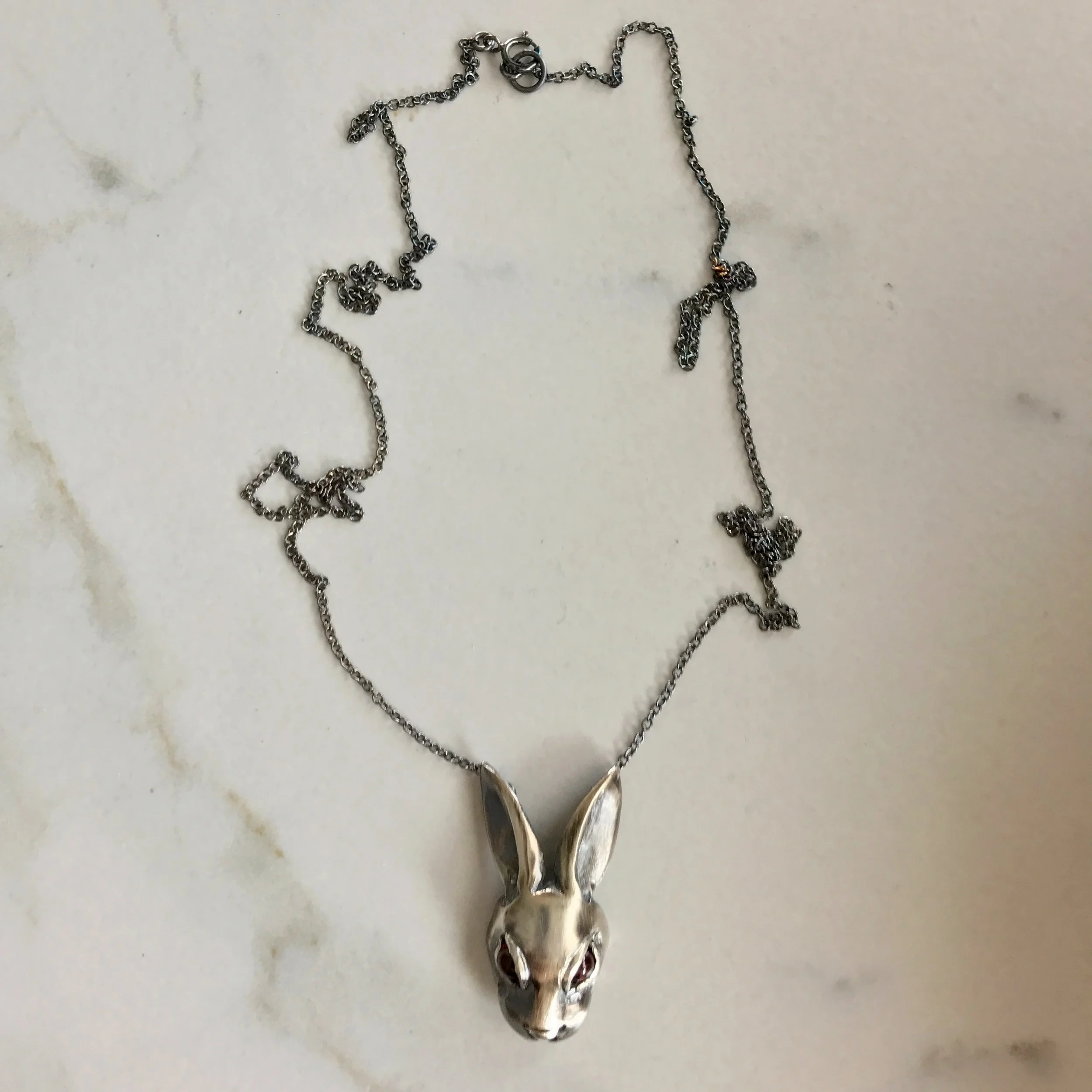 Evil Bunny Necklace with Red Garnet Cabochon Eyes in Oxidized Sterling Silver by Beloved Little Lamb