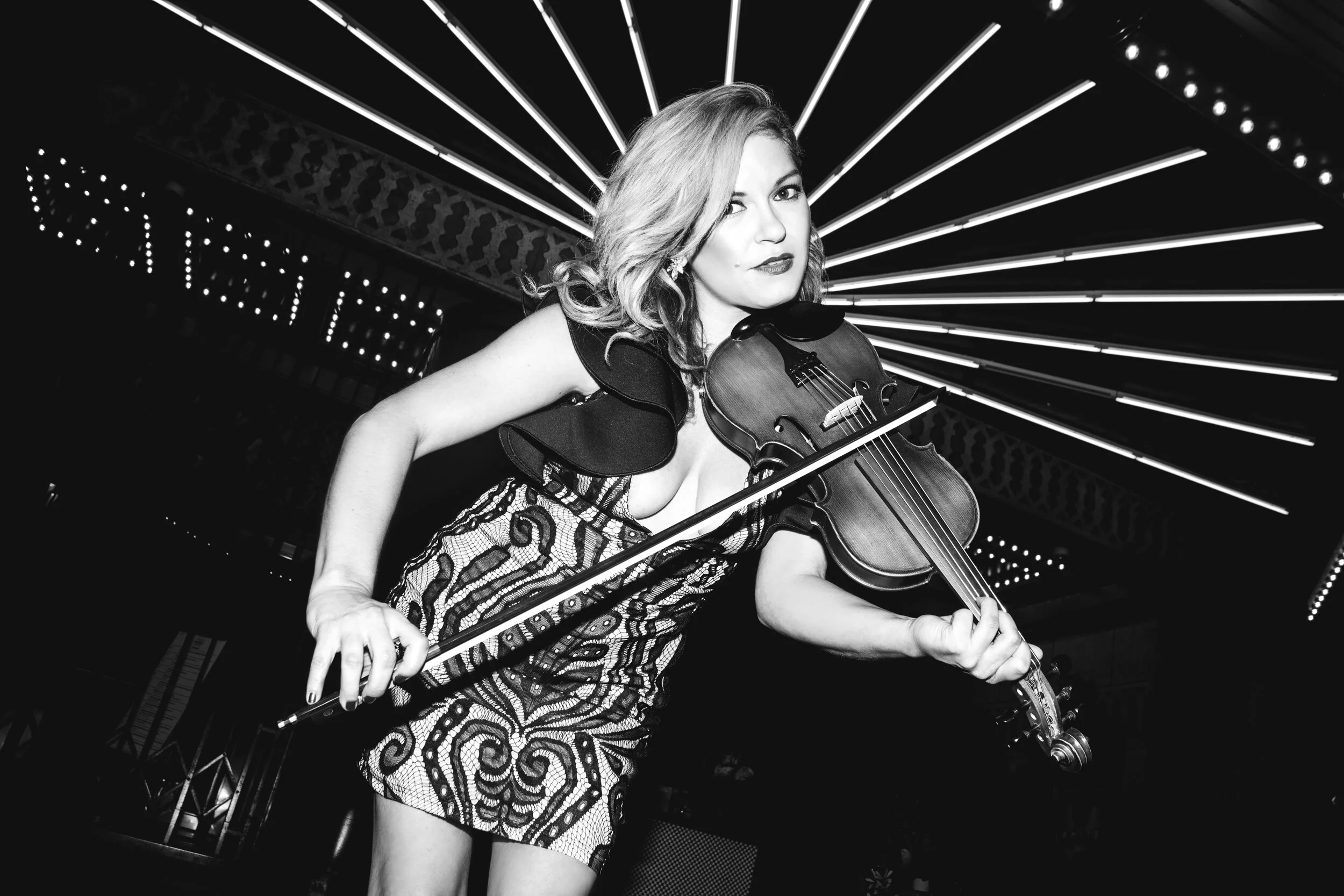 Brittany Cotto performing violin at a live event