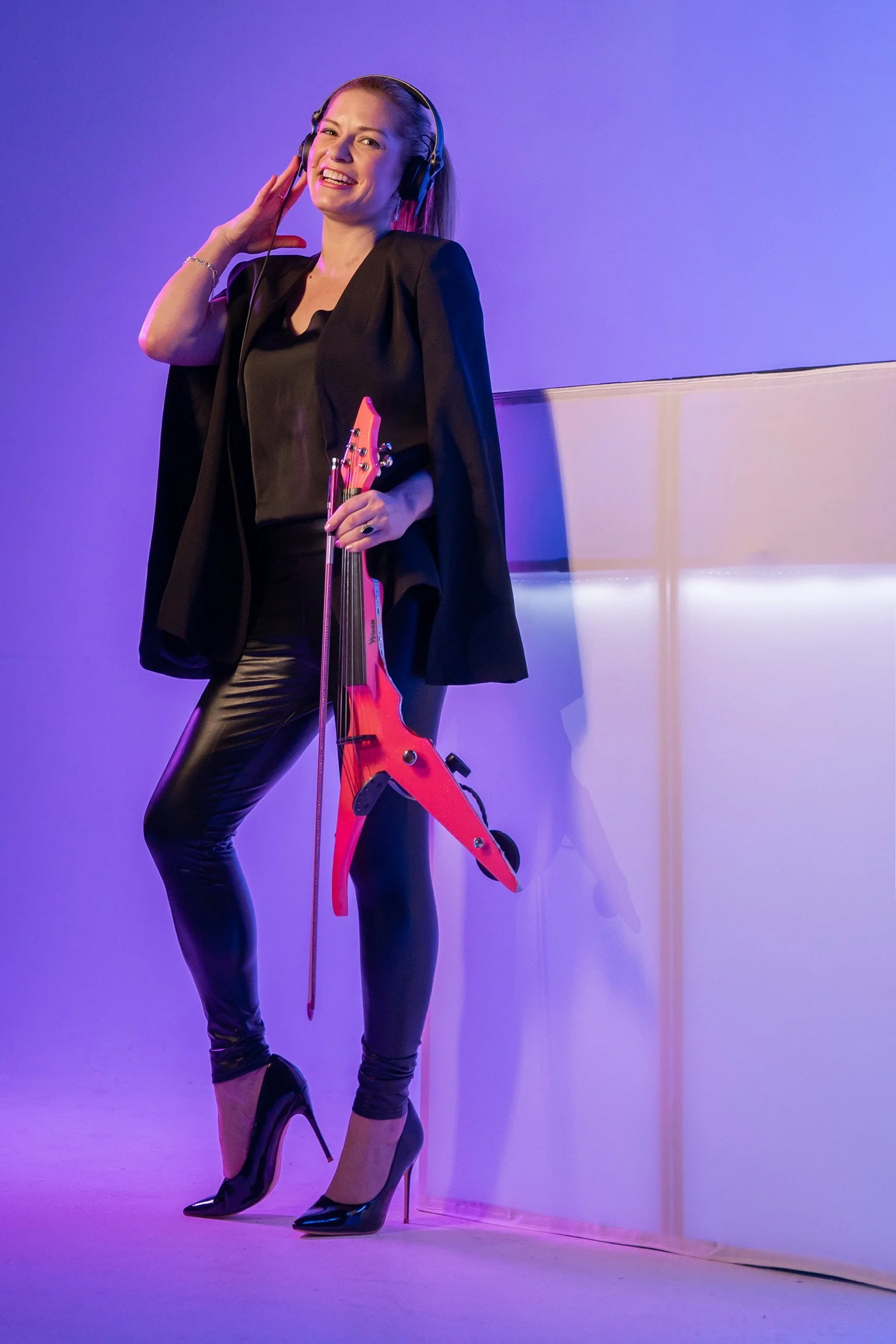 Brittany Cotto creating custom DJ and live violin performance visuals during a studio photoshoot.
