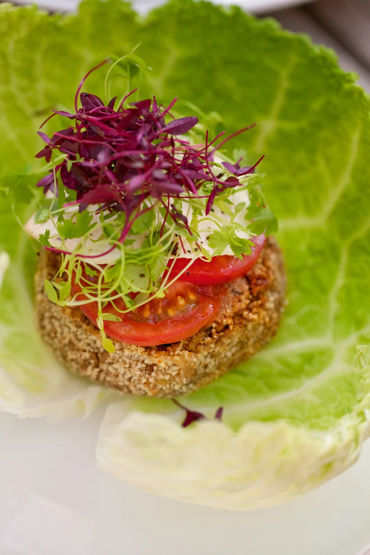 We topped the burger with ketchup and mayo, slices of tomato and vegetarian mozzarella and some pretty micro leaves, before wrapping around the savoy cabbage leaf. Knives and forks not needed!