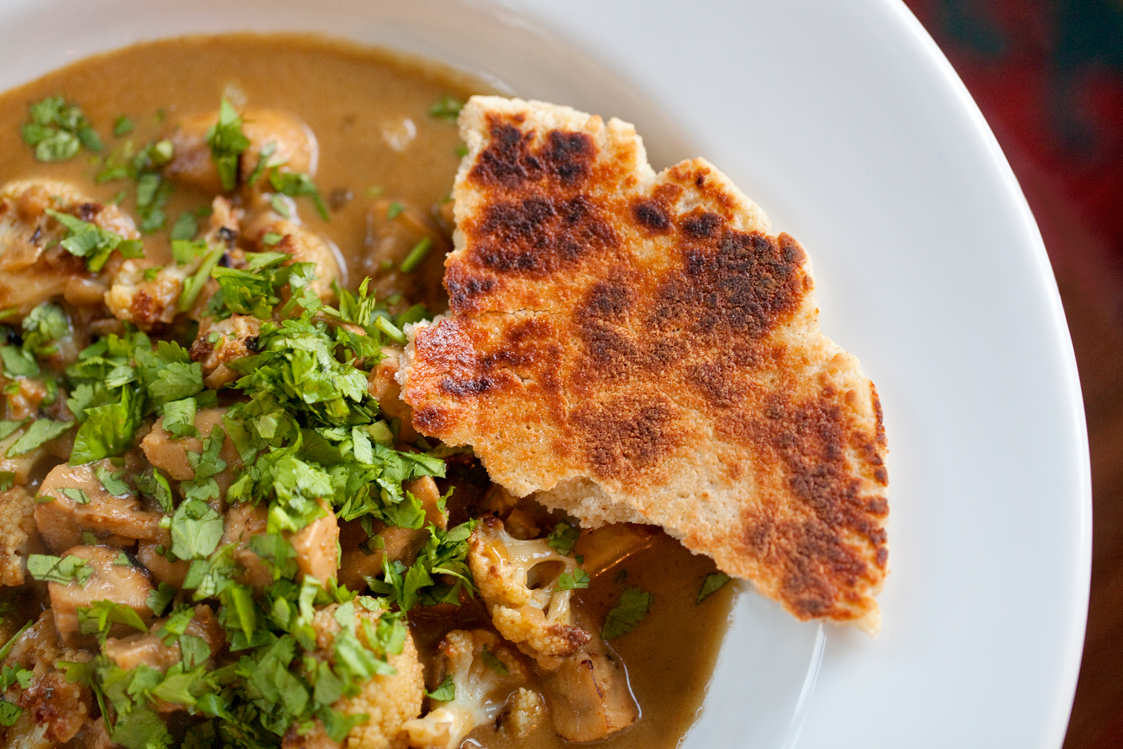 Grain-free, gluten-free Primal Naan Bread is the perfect sharing bread to eat with curries and Indian food, shown here with Cauliflower & Mushroom Curry