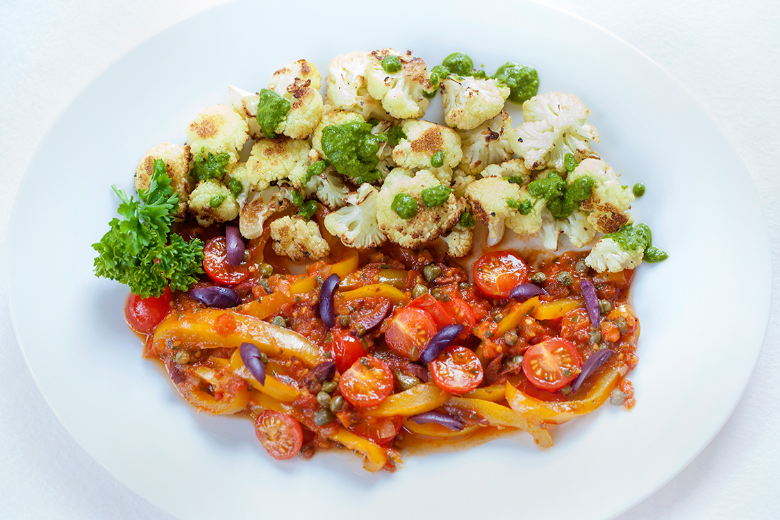 For vegetarians and vegans, the Mediterranean Sauce also goes well with roasted cauliflower, served here with lemon-herb dressing 