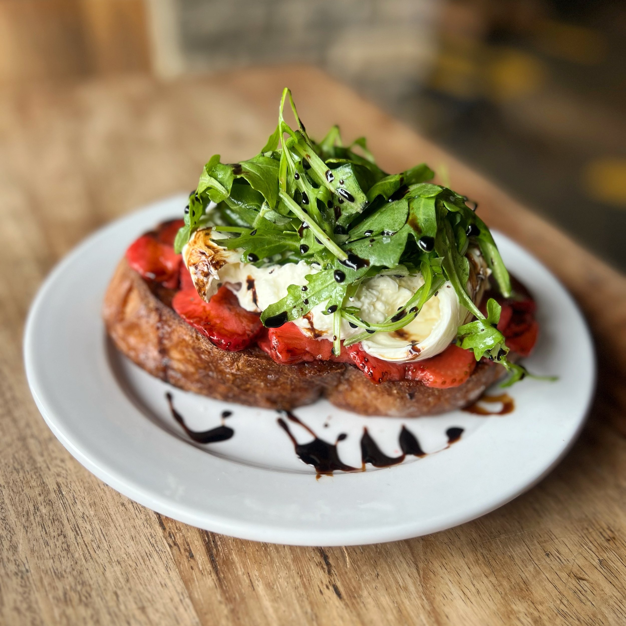 Burrata makes everything better!  With strawberry, arugula, basil &amp; balsamic reduction on house ciabatta.  On our dinner menu 🍓