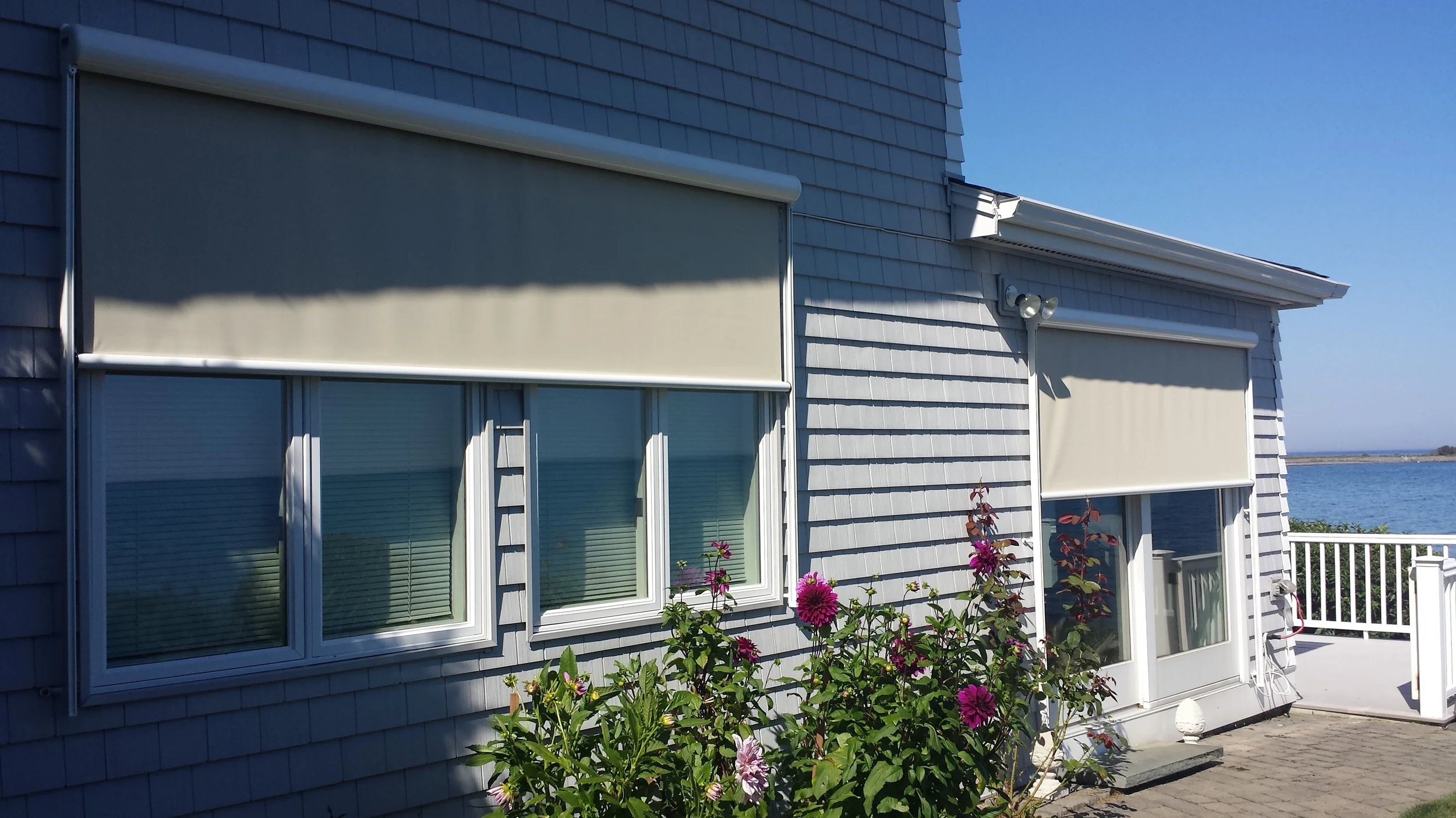 Solar shades to block out the sun at certain times of day, can also look stylish and fit in well with a homes design. These were installed by Betterliving Sunrooms of NH in Kittery, Maine.