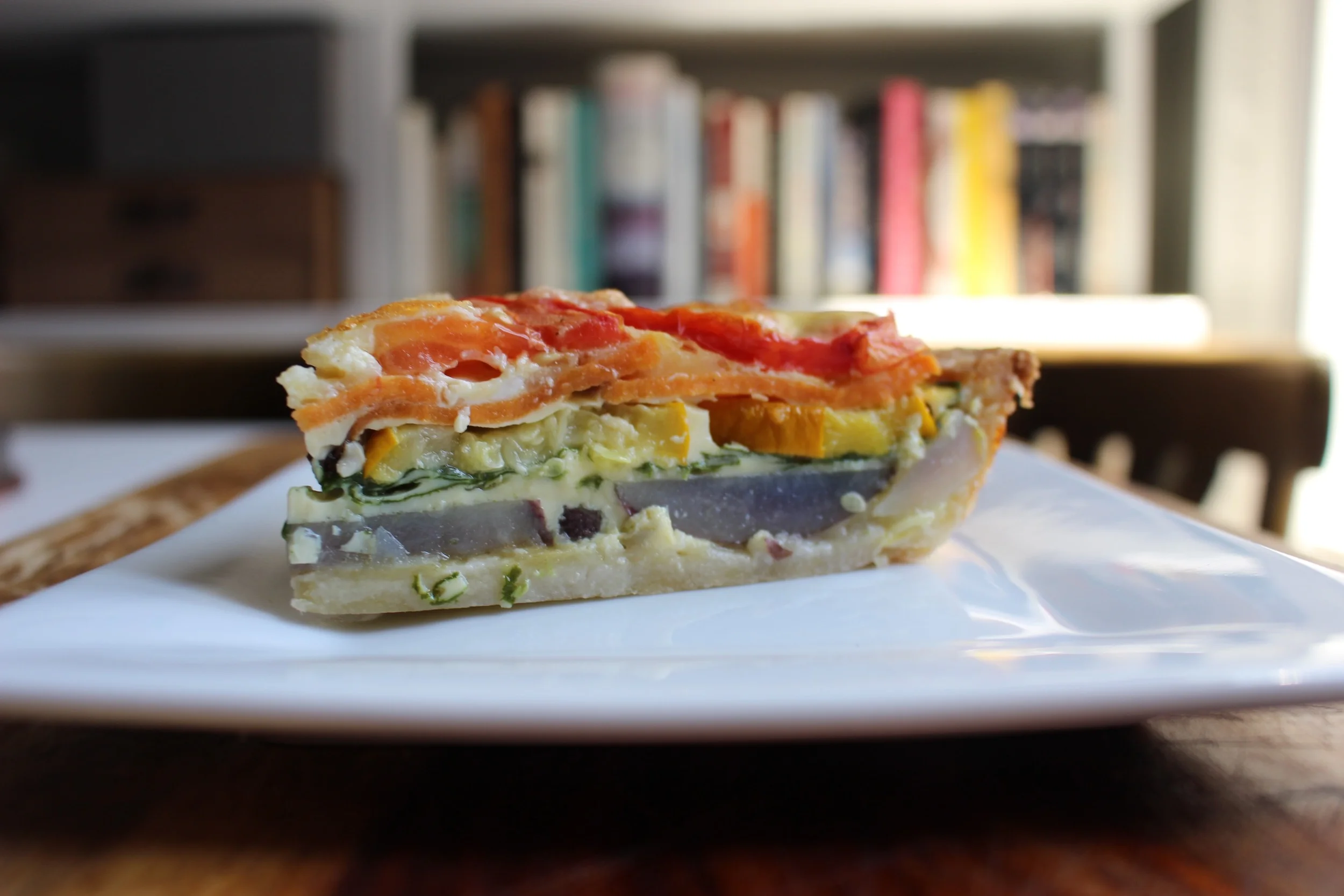 Rainbow vegetable quiche | Me & The Moose. This quiche is a tasty and pretty way to get your toddlers to eat veggies. It also cubes easily for a finger food. #meandthemoose #quiche #vegetarian #vegancrust #brunch