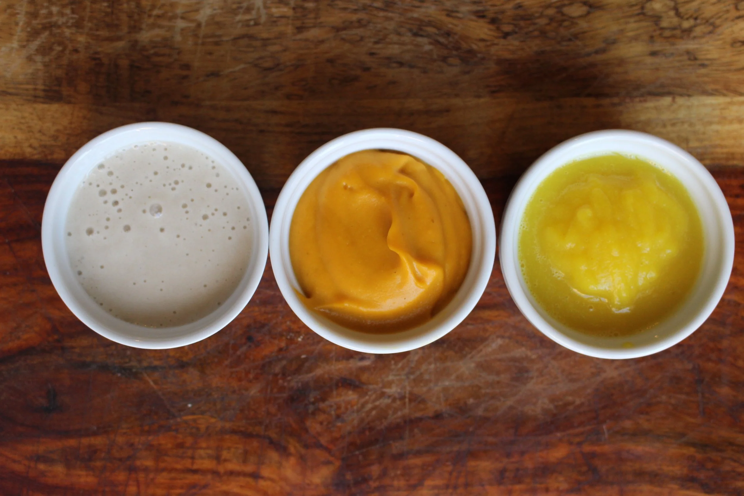 The colors of candy corn, but none of the preservatives. Candy corn popsicles | Me & the Moose #meandthemoose #candycorn #popsicles #puree #coconut #sweetpotato #pear #turmeric