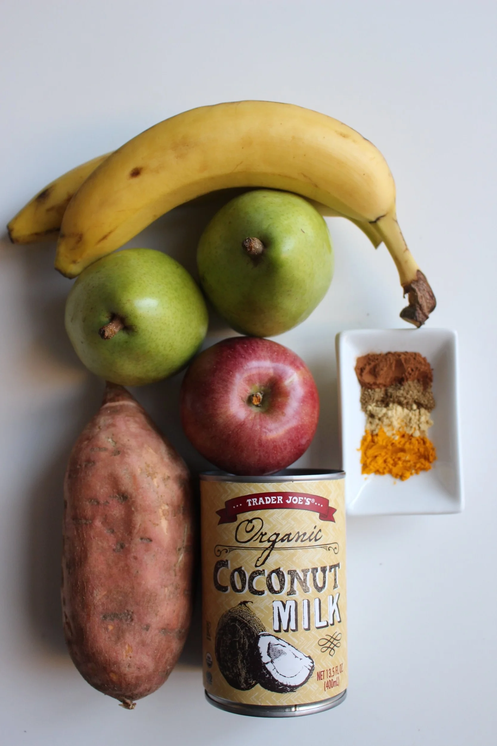 The colors of candy corn, but none of the preservatives. Candy corn popsicles | Me & the Moose #meandthemoose #candycorn #popsicles #puree #coconut #sweetpotato #pear #turmeric