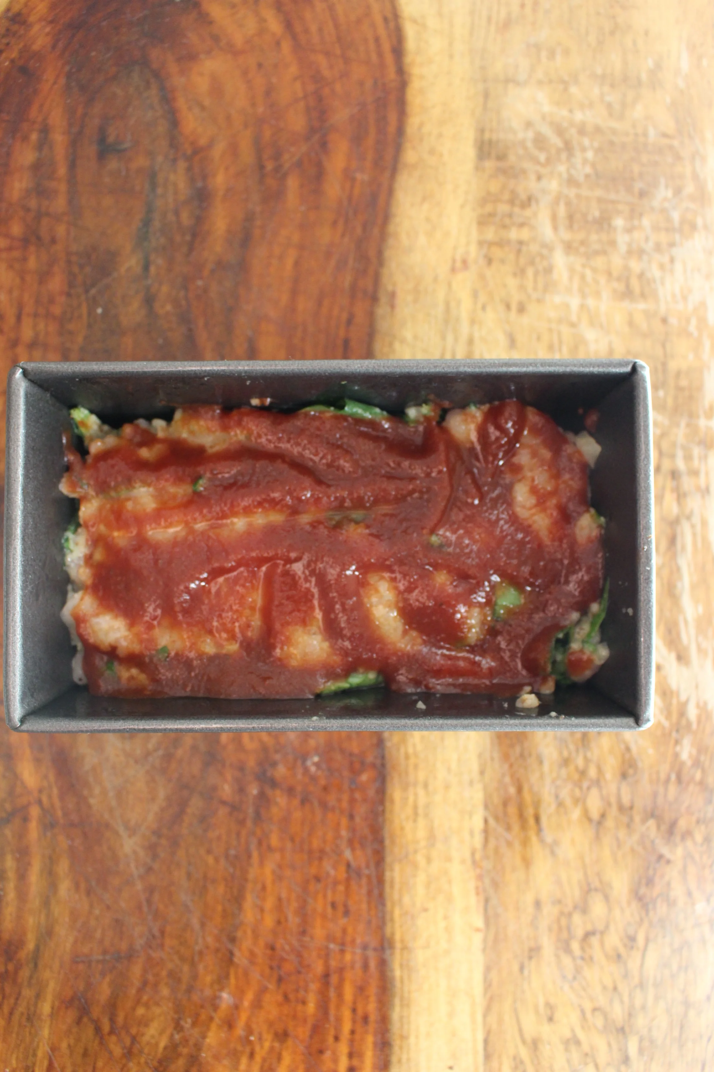 Gluten-free Turkey and Spinach Meatloaf | Me & The Moose. Top this healthy and filling meatloaf with tomato paste instead of ketchup to hold in moisture without adding sugar. #meatloaf #dinner #turkey #spinach #whole30