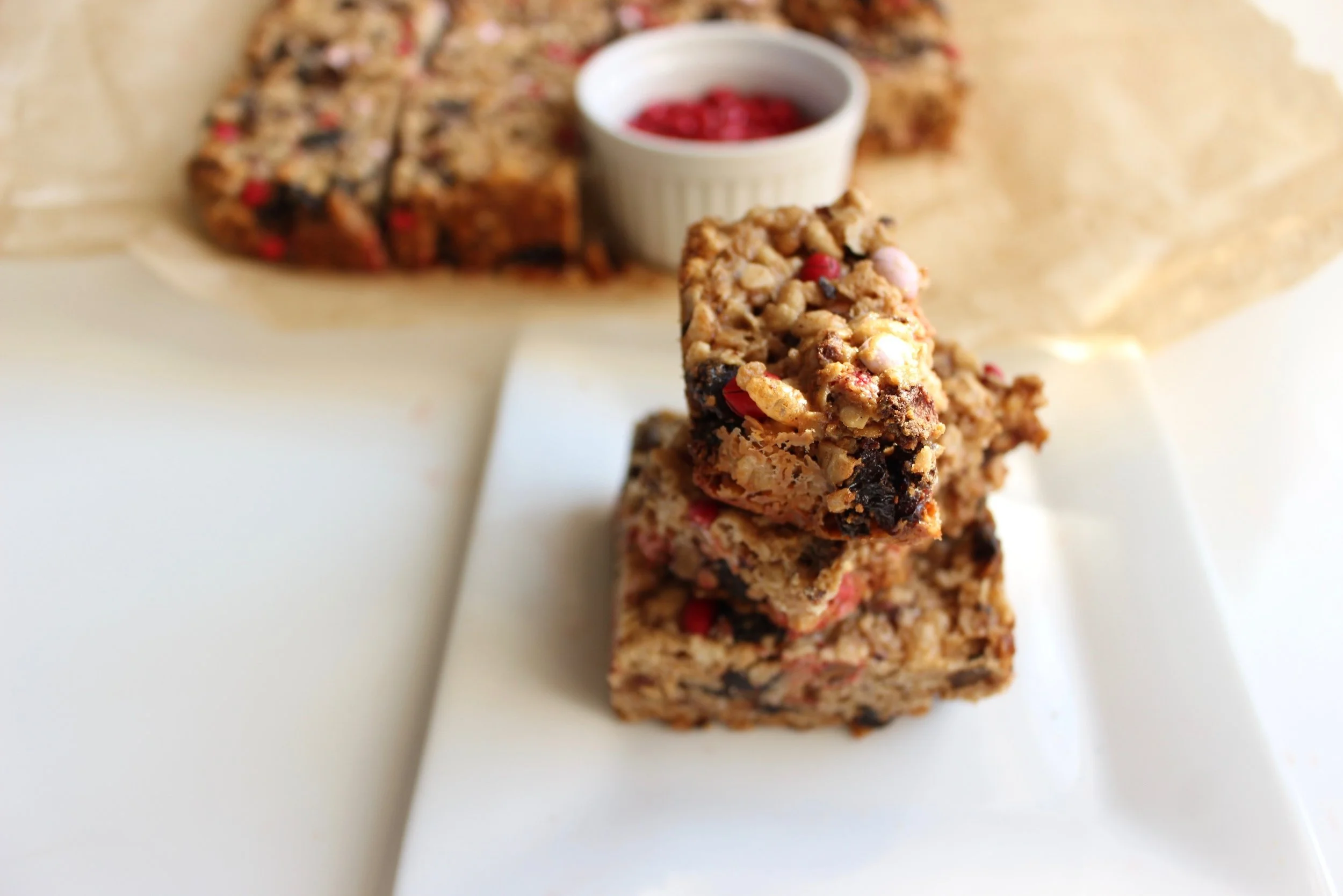 Healthy strawberry and cherry granola bar | Me & The Moose. These chewy granola bars are a mixup of granola bars, oatmeal cookies, and rice krispy treats, but healthier and more filling than any of the traditional ones. #meandthemoose #granolabarrecipes #nutfree #glutenfree #naturalsugar #granolarecipes #granolabarrecipes #snacks #snackrecipes