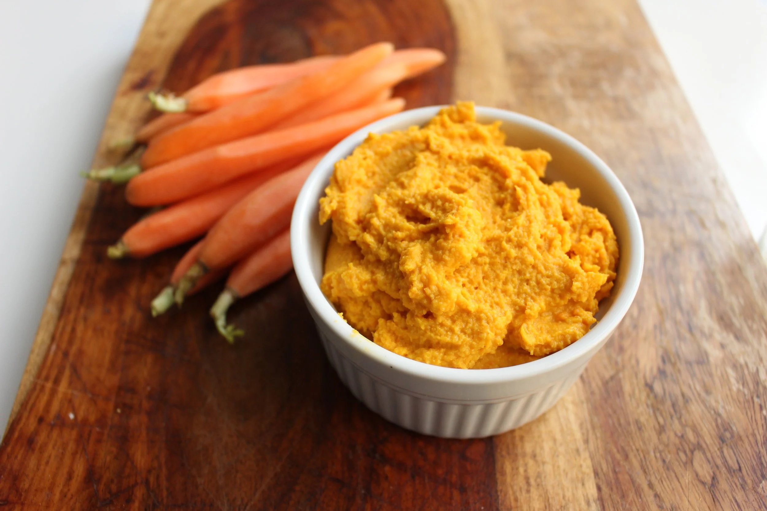 Roasted carrot hummus | Me & The Moose. Roasted carrots sweeten up this spicy, complex, EASY hummus. #meandthemoose #snackrecipes #hiddenveggies #snacks #roastedcarrots #hummus #homemadehummus #hummusrecipes
