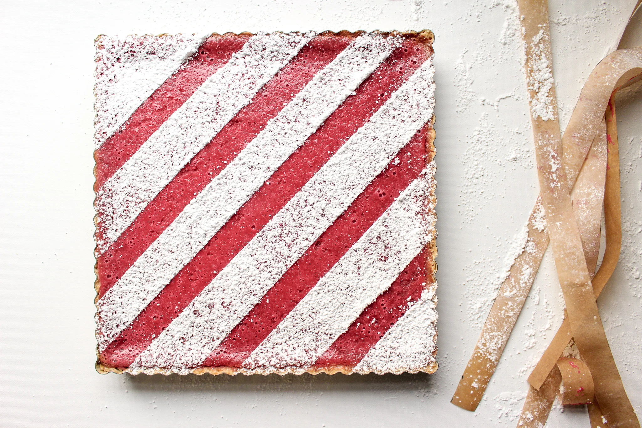 Cranberry bars | Me & The Moose. These simple cranberry bars are a showstopper that looks complicated, but is actually easy to bake ahead and cut up for cookie swaps, office holiday parties, and your cookie tray. #cranberrybars #christmasbaking #lemonbars #meandthemoose #holidaydesserts #batchbaking