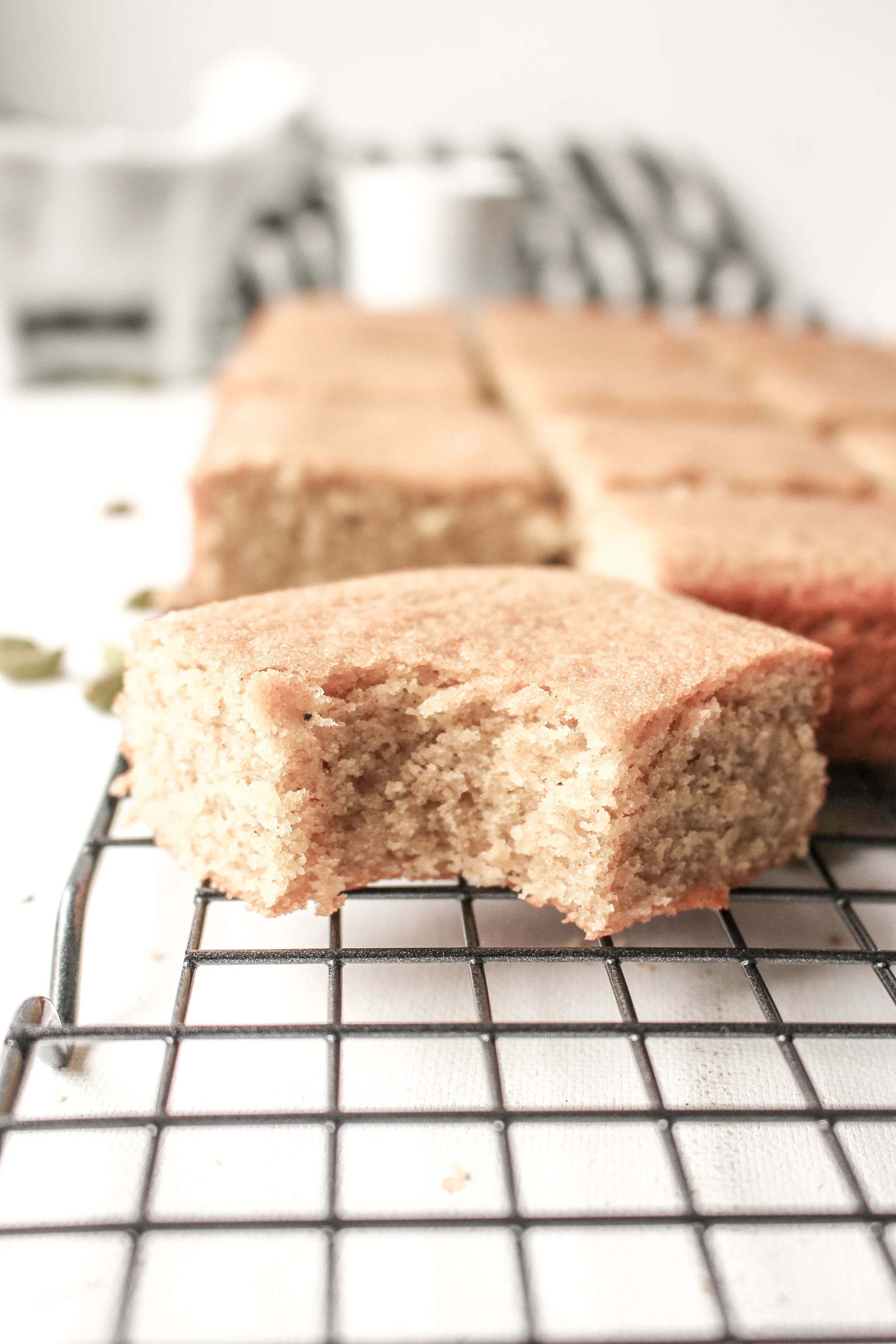 Coffee and cardamom blondies | Me & The Moose. These bar cookies are spiced, sweet, and dense, require one bowl, and are great for a crowd. #meandthemoose #blondies #coffee #cardamom #batchbaking #Christmasbaking #uniquedesserts #easydessertrecipes