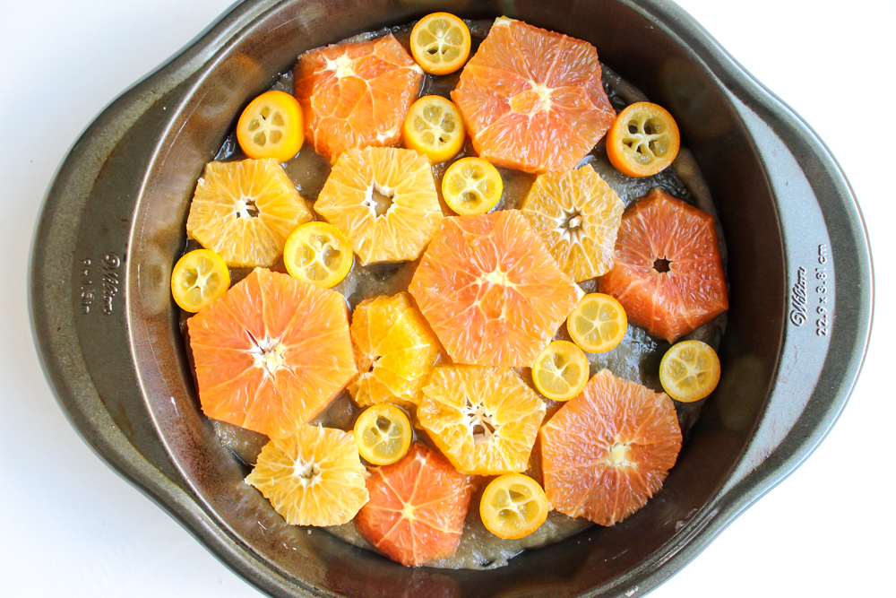 Orange and almond upside down cake | Me & the Moose. Cara cara oranges, clementines, and kumquats baked in a light syrup really shine in this simple, lightly sweet, and naturally gluten-free upside down cake. #meandthemoose #citruscake #citrusrecipes #healthybaking #oranges #almonds #glutenfreerecipes #glutenfree #upsidedowncake