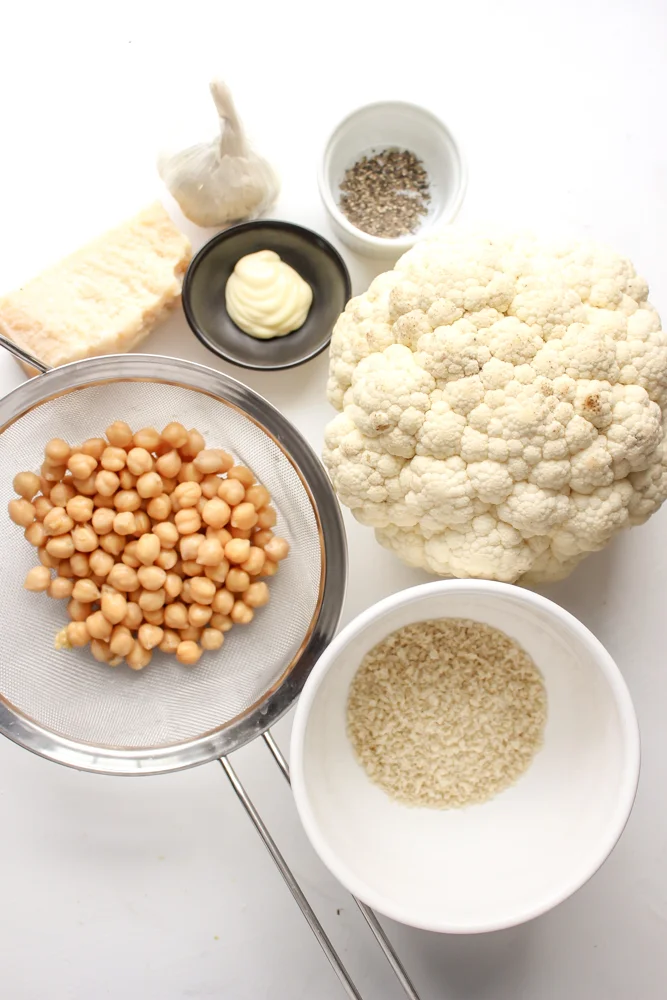 Cacio e pepe cauliflower and chickpeas | Me & The Moose. This vegetarian sheetpan dish hits all the right notes of cheesy, creamy, crunchy, and delicious. It’s filled with protein and appealing to vegetarians and carnivores alike. #meandthemoose #sheetpanmeals #vegetarianrecipes #cauliflower #cheese #cacioepepe #chickpeas #vegetarian #vegetariandinners