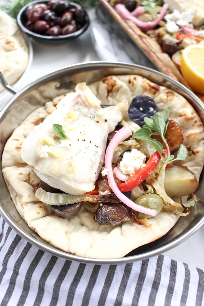 Sheet pan dinner: White Fish with Potatoes and Fennel | Me & The Moose. This one pan wonder dinner is ready in 40 minutes and features fish and veggies dressed up with all the sweet, salty, creamy, briny, and crunchy toppings you could want. #meandthemoose #sheetpandinner #onepandinner #dinnerrecipes #Mediterraneandiet #fishrecipes #pescatarianrecipes #glutenfreerecipes #dairyfreerecipes