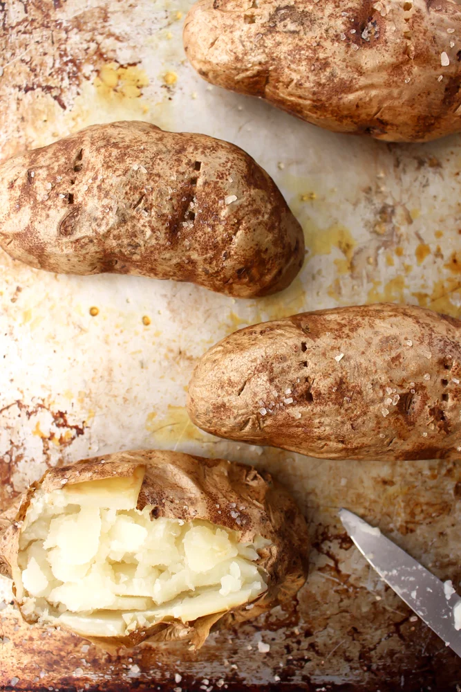 Sloppy Joe baked potatoes | Me & The Moose. This lightened up version of sloppy Joes uses turkey meat and the bare minimum of sweetener in the filling and forgoes a carby bun for a crispy, salt, malt-vinegary baked potato. #meandthemoose #dinner #sloppyjoes #sloppyjoerecipes #healthysloppyjoes #healthyrecipes #healthydinnerrecipes #healthydinner #bakedpotato #glutenfree #dairyfree #kidfriendlydinner #familyfriendlydinner