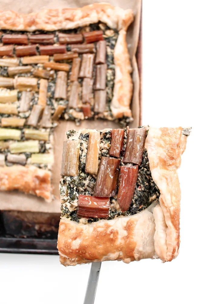 Rainbow Chard Galette | Me & The Moose. This galette is a super-easy show stopper for Easter and beyond! we ate it for dinner last night and the preschooler didn’t bat an eye at the heaps of greens. #meandthemoose #rainbowchard #sidedishes #vegetarian #vegetarianrecipes #rainbowchardrecipes #farmersmarketrecipes #easterrecipes #easterbrunchrecipes #easterdinnerrecipes