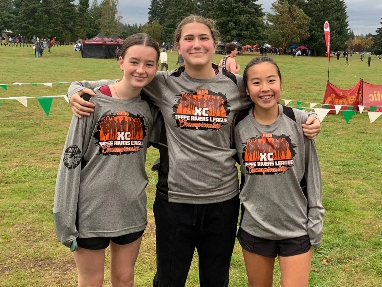 Happy customers with custom shirts at an event