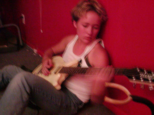 Way past "the hippie stuff." Around 14 years old, playing my first and favorite electric guitar in my barn-turned-practice space. Probably playing something off Black Flag's "Damaged." I cut my own hair with kitchen scissors in a melodramatic love rage (how could he kiss HER down by the creek??!), so obviously it looks amazing(ly butch). I often wonder if I was not indeed destined for a career in hair.