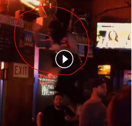 Ape jumping off bar.
