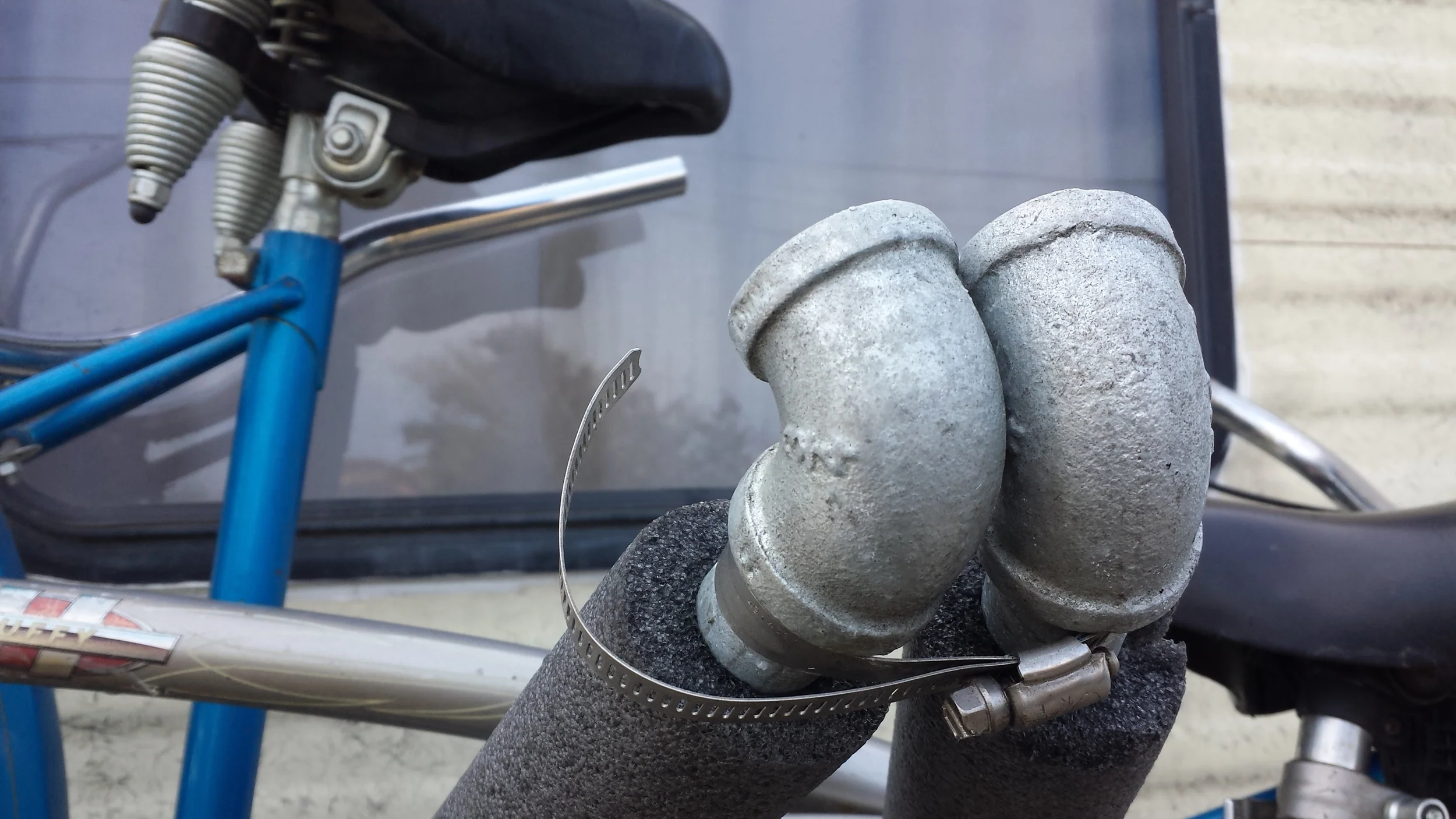 This is the smaller of the 2 steel locking fasteners. If we had more time we would have found a 10" reverse threaded pipe to use as the top bar, but in interest of time, we just made it a triangle