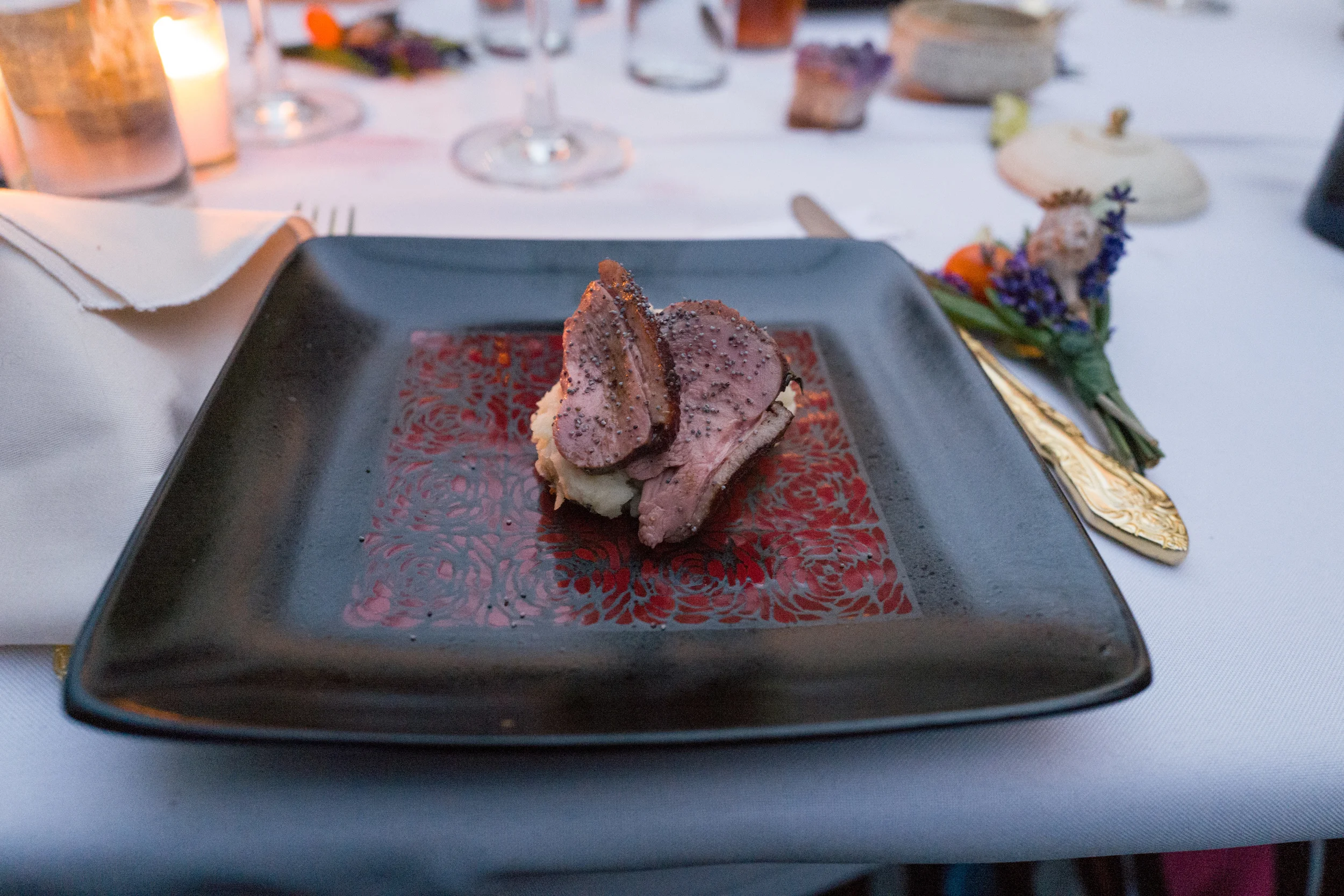 Peking Style Duck Breast on Mashed potatoes draped with toasted poppy seeds. Photo by Victoria Smith. 