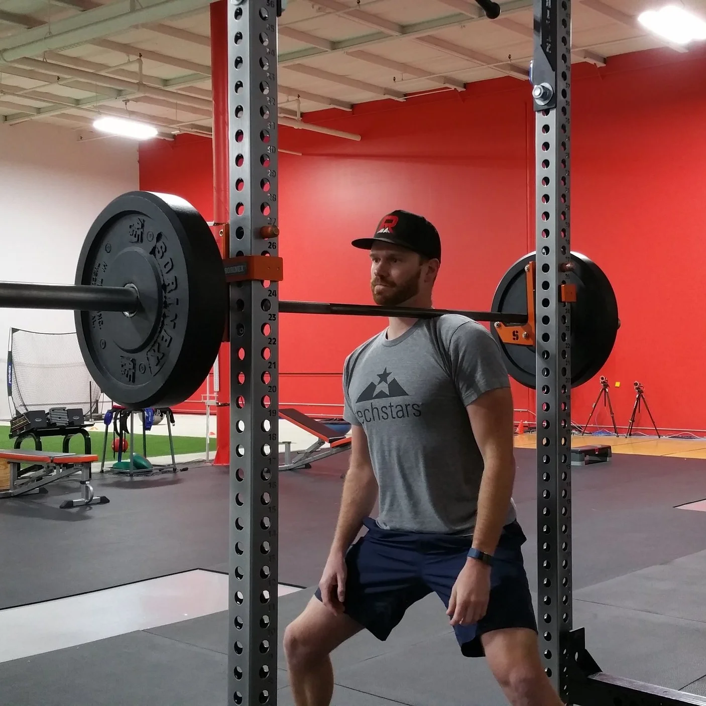 Bar near the neck, pressure through the upper trap onto the rib. 