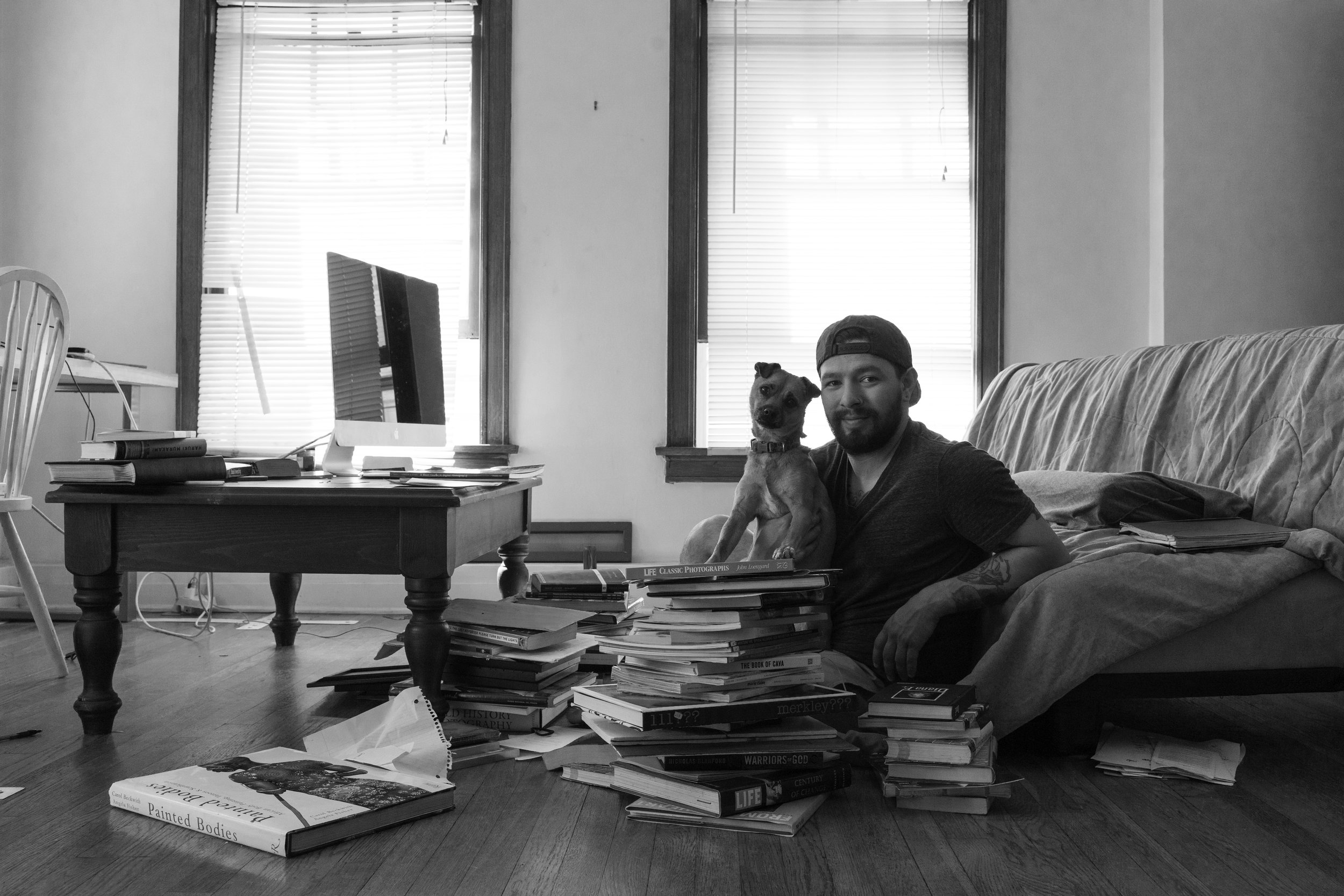 self-portrait of me and my Puppy Rocky, boy does she love photography books!