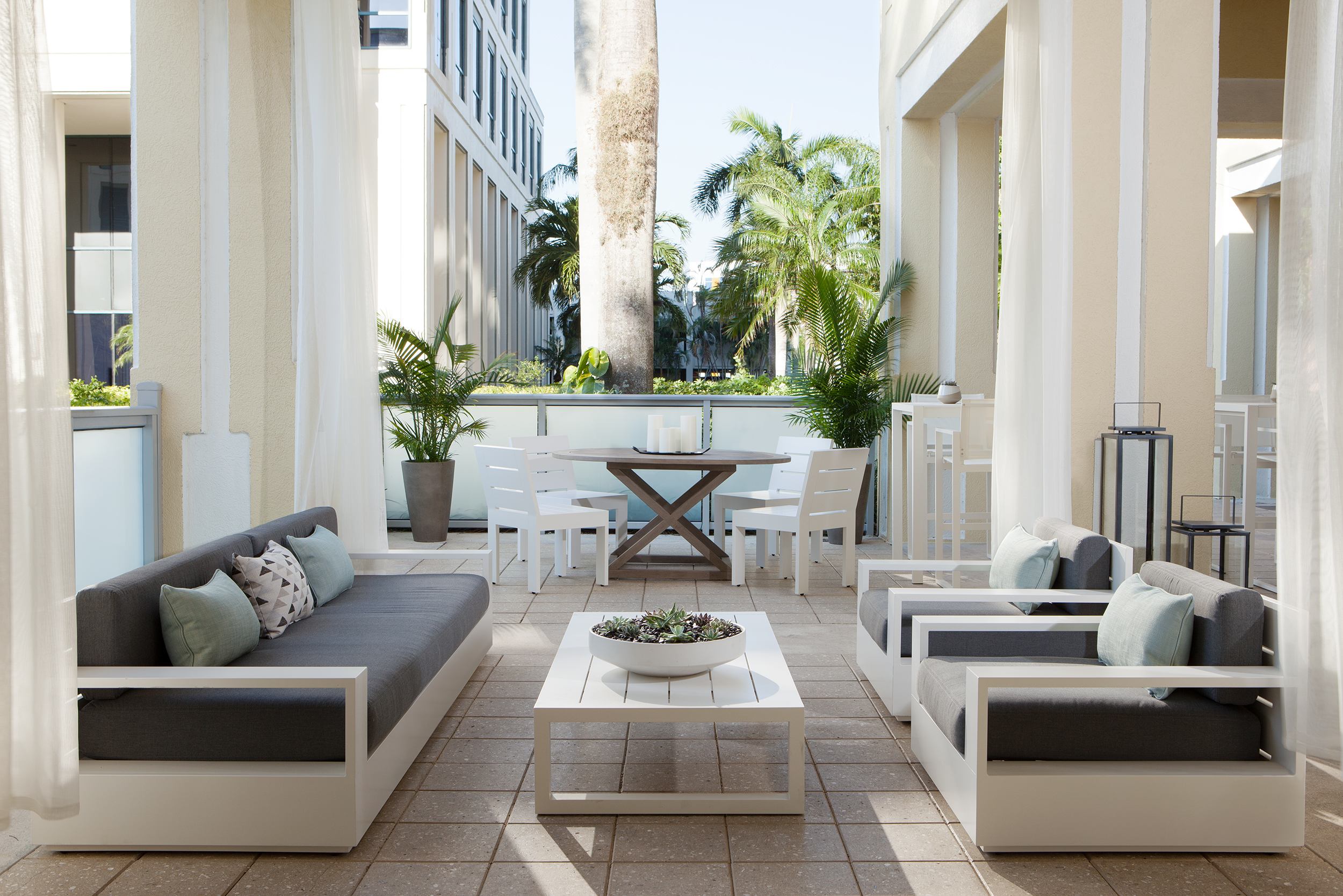 1 hotel hospitality styling outdoor living room lounge palm trees.jpg