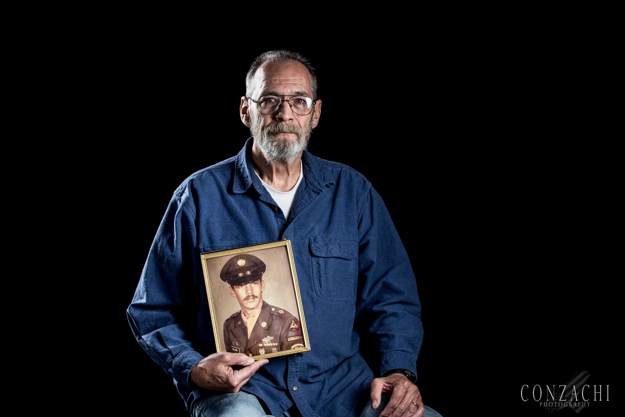 Emery Williams, 65 Branch: Army Status: Disabled Veteran, Retired. MOS: Armor Crewman(M-48 M-60 Tanks/M-1 Mech), 11E/45E Years Served: 1969-1978, 1987-1992, 1992-2000 Deployments: 69-70 Vietnam, 72-75 Germany, 91-92 Germany Highest Rank: E-6 Staff Sergeant Notable Awards: Combat Infantry Badge, German Marksmanship Gold His Story: "I enlisted in March 1969, and got to the Republic of Vietnam in October of that same year. I came down with malaria in September 1970. I was weighing around 180lbs. 5 weeks later I got to my brother's house at a strapping 140lbs. I bought a honda 350 from my cousin and rode it to Fort Hood, TX. Tuned it up and bought a Harley Davidson. I went to Germany and discovered REAL beer! I then went to Fort Polk, LA and discovered REAL food. I left active duty for an extended party, then went back to active duty to finish my career. In 1992 my mother had a stroke, so I left active duty to help take care of her and joined the National Guard. Good Times!" From the Author: Meeting Emery was an honor. This proud veteran had a very humble attitude and wanted a simple picture of himself now holding a picture of himself back in his early days in the military. He quotes, "there's quite a bit of mileage in between that pic and me now haha". Thank you Emery for your service, and Happy Veterans Day.
