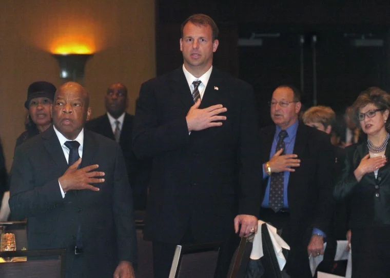Congressman John Lewis, left, and Congressman Jon Runyan, center, stand during the playing of the National Anthem, at the National Stop the Violence Alliance's Celebration of Hope Gala, at the Westin Hotel in Mount Laurel. Lewis, a civil rights icon, was honored with a bust on Saturday night for all his years of battling oppression and inequality. Congressman Lewis was one of several being honored. Photo courtesy of: Pete Picknally/BCT Staff Photographer