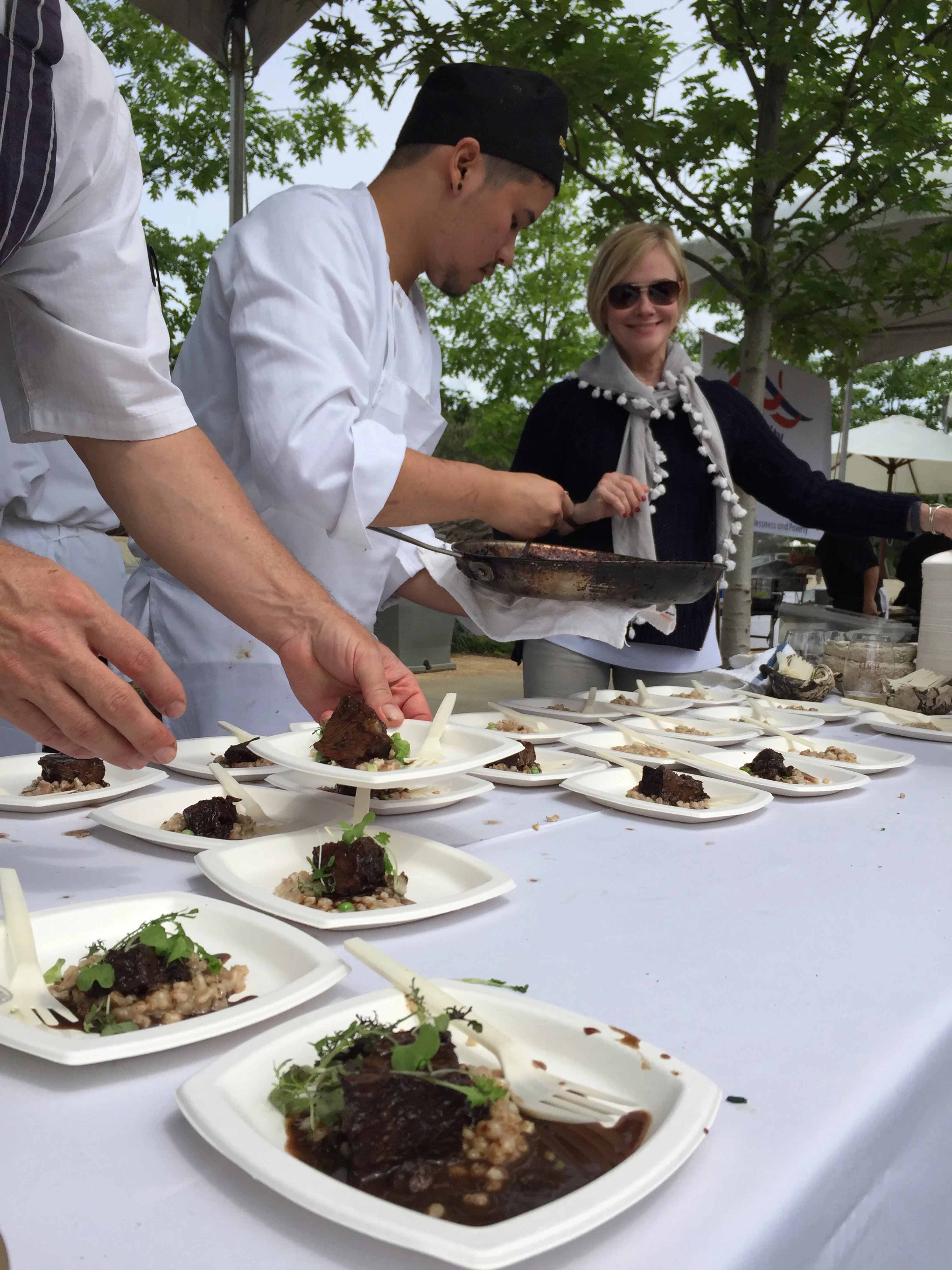 The chefs finishing the oxtail risotto.