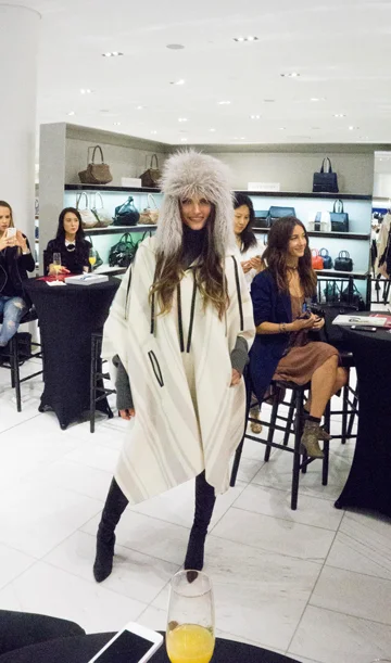I personally LOVE ponchos. You're essentially wearing a blanket but it's tailored. And stunning, like this 3.1 Phillip Lim poncho with the Stella McCartney faux fur hat. Boots: Stuart Weitzman. 