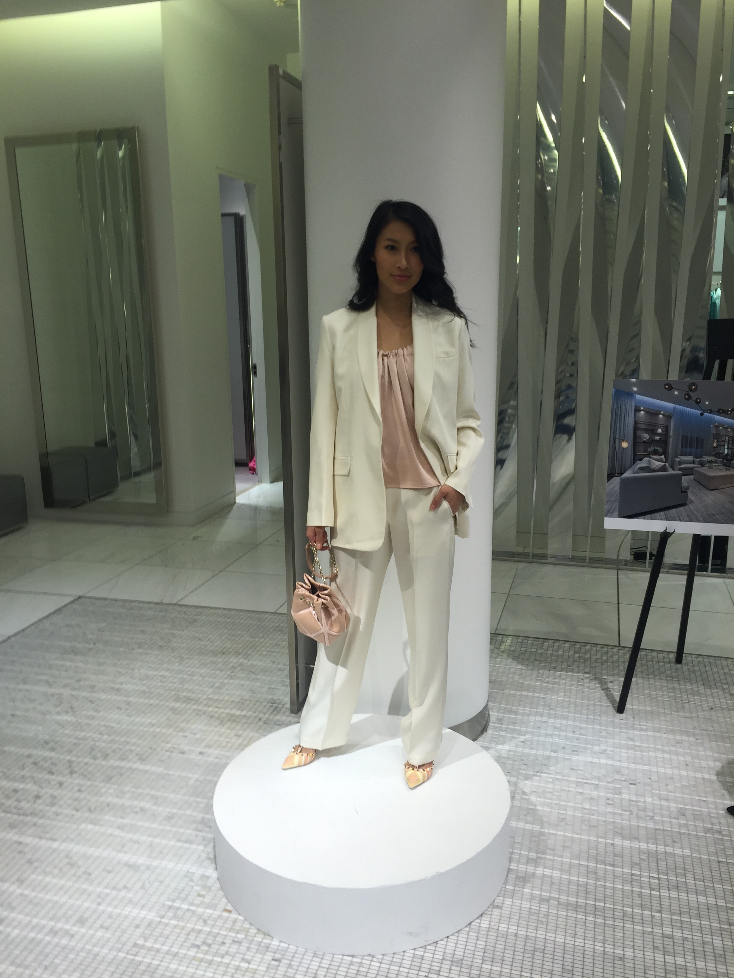 Suit and pink shell, HELMUT LANG. shoes, VALENTINO. bag, ROGER VIVIER.