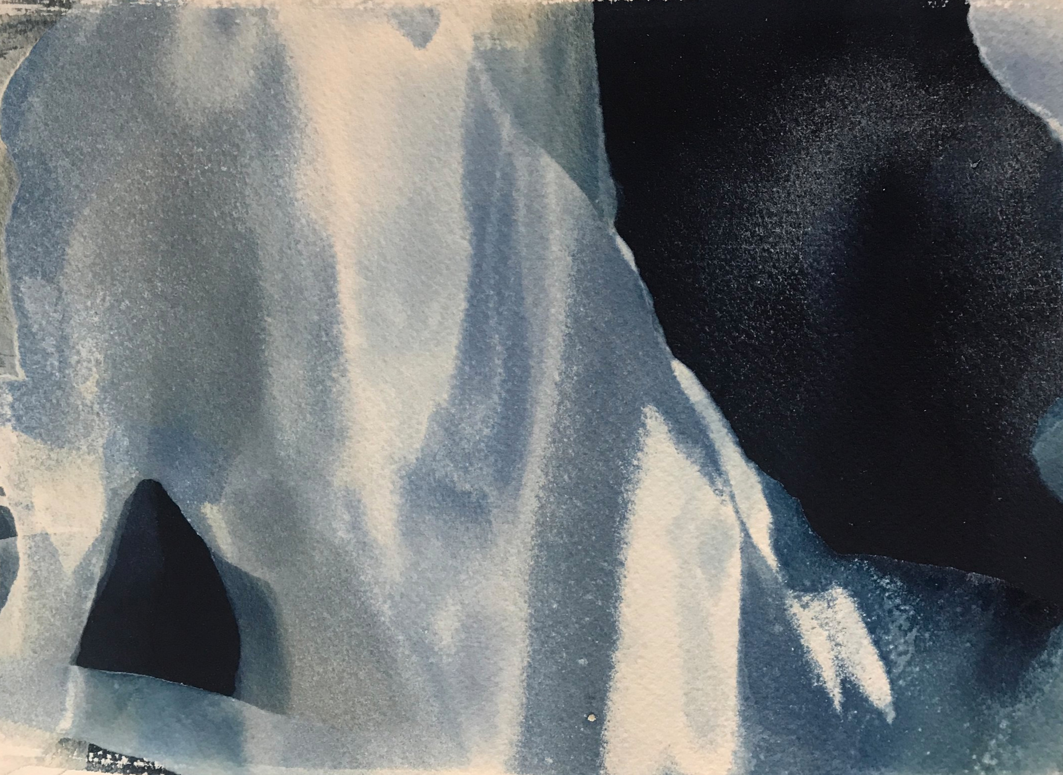 Sand and water rush over paper to create unique cyanotype